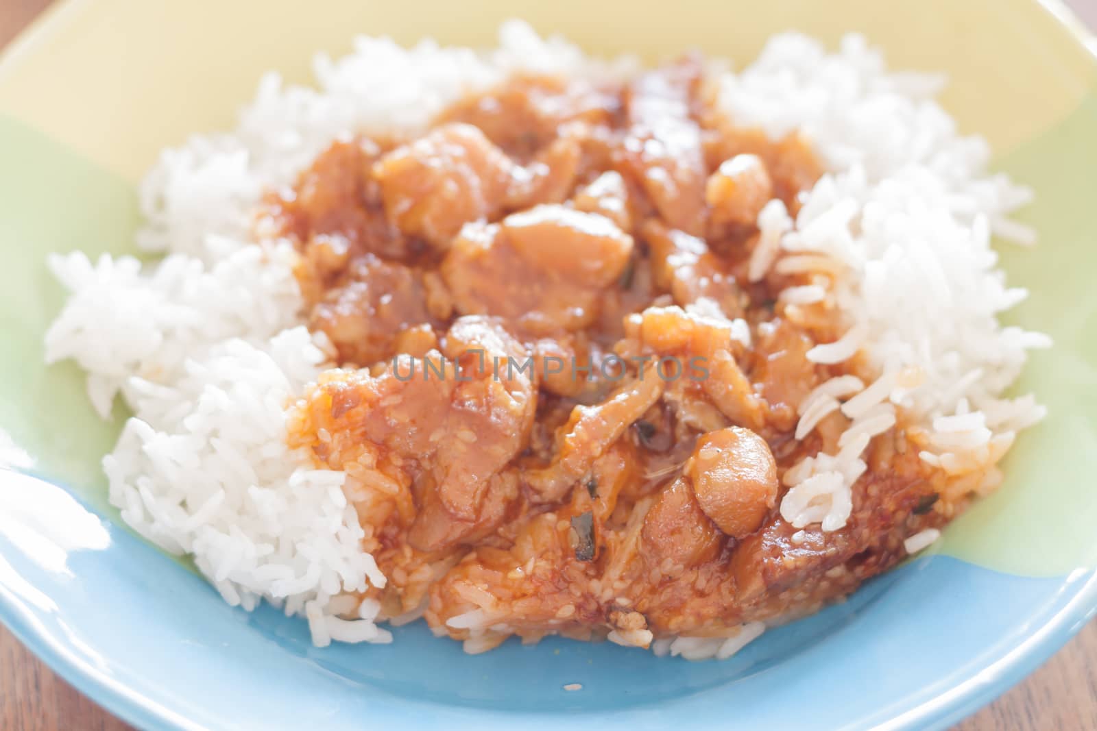 Stirred pork with sauce top on rice, stock photo