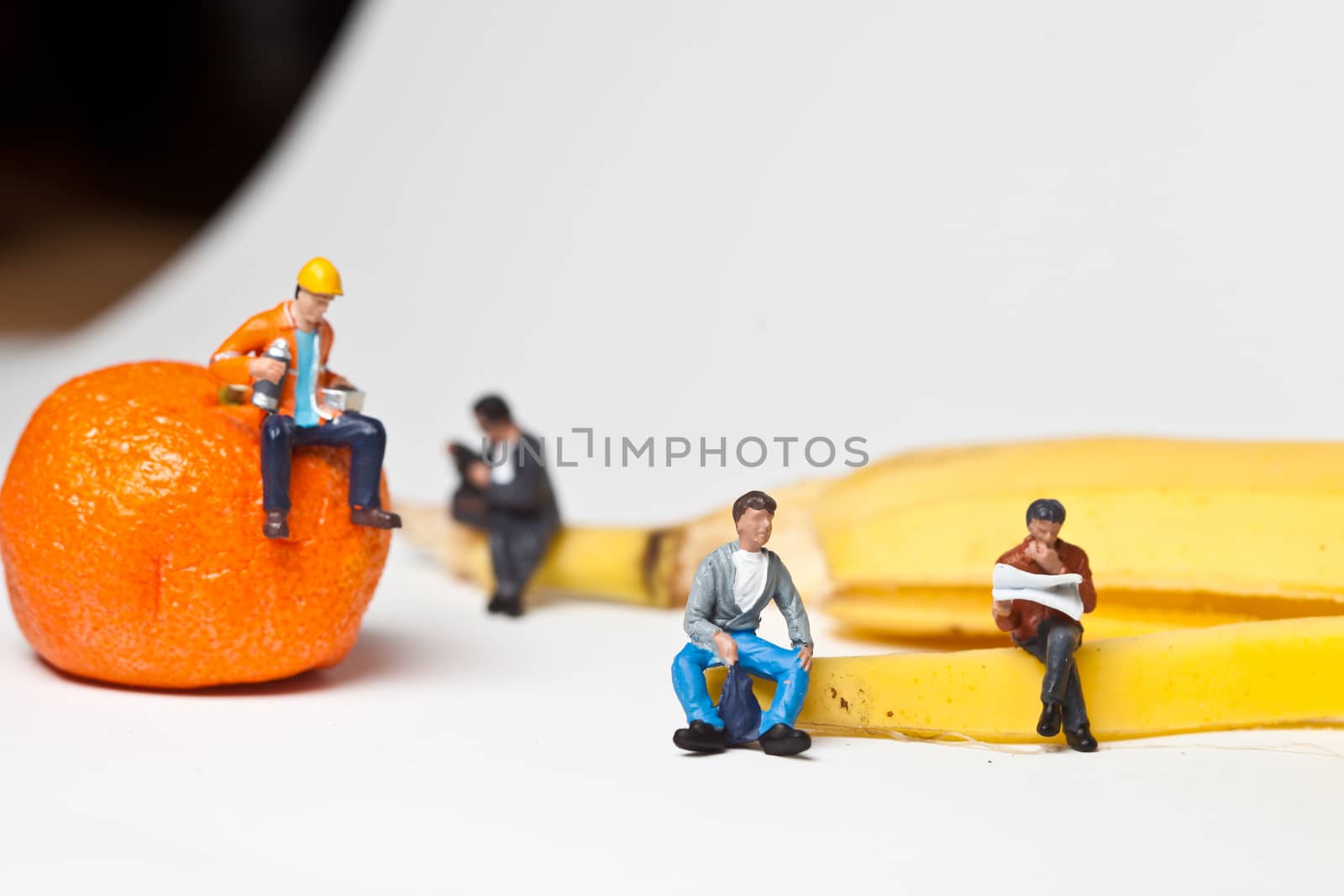 Miniature people in action in various situations
