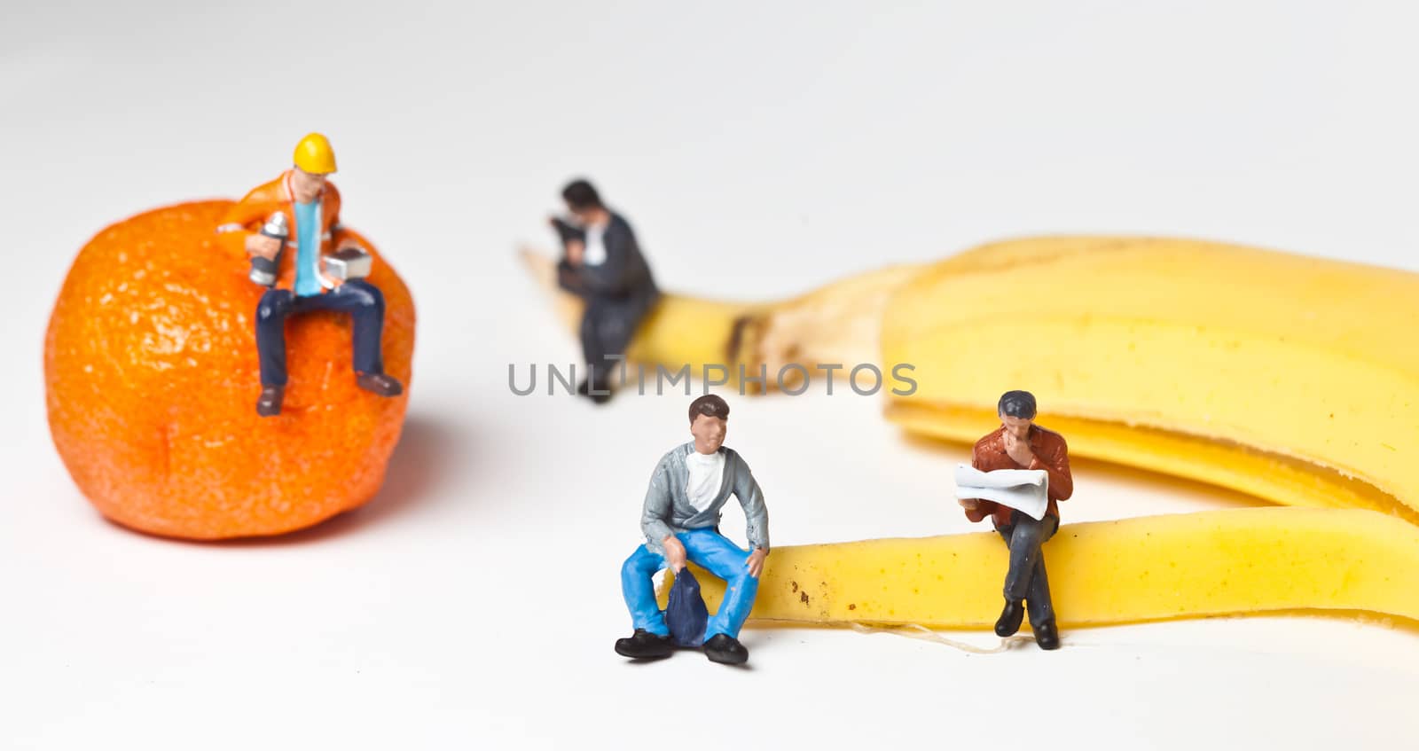 Miniature people in action in various situations