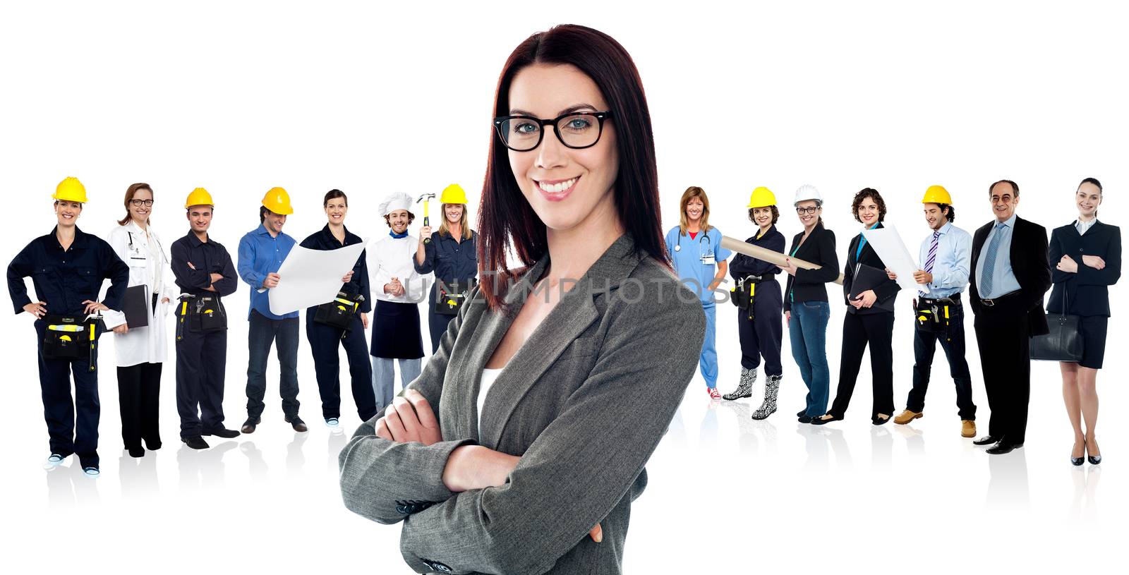 Confident woman leading a business team by stockyimages