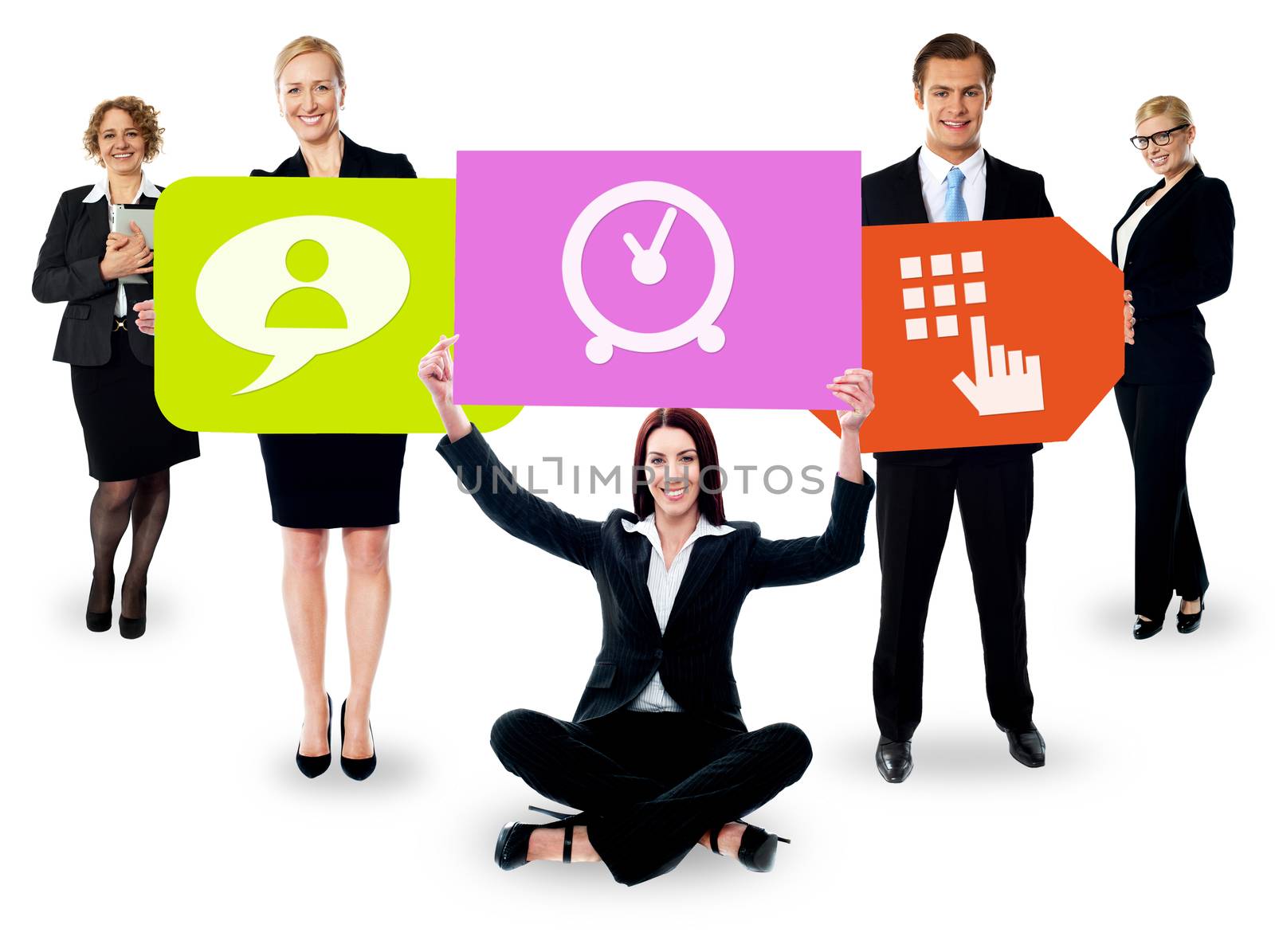 Business people holding colorful boards by stockyimages