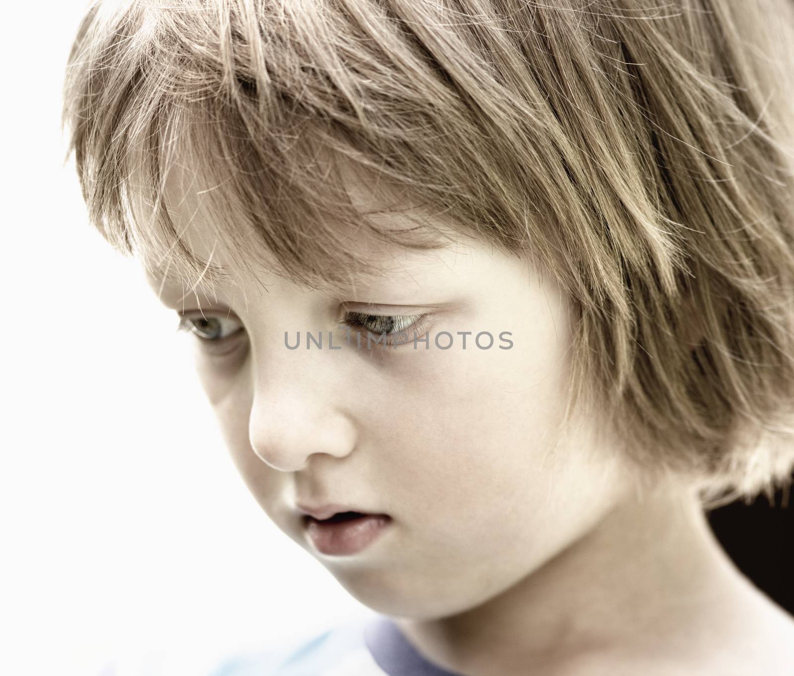 Portrait of a Boy with Blond Hair Outdoors