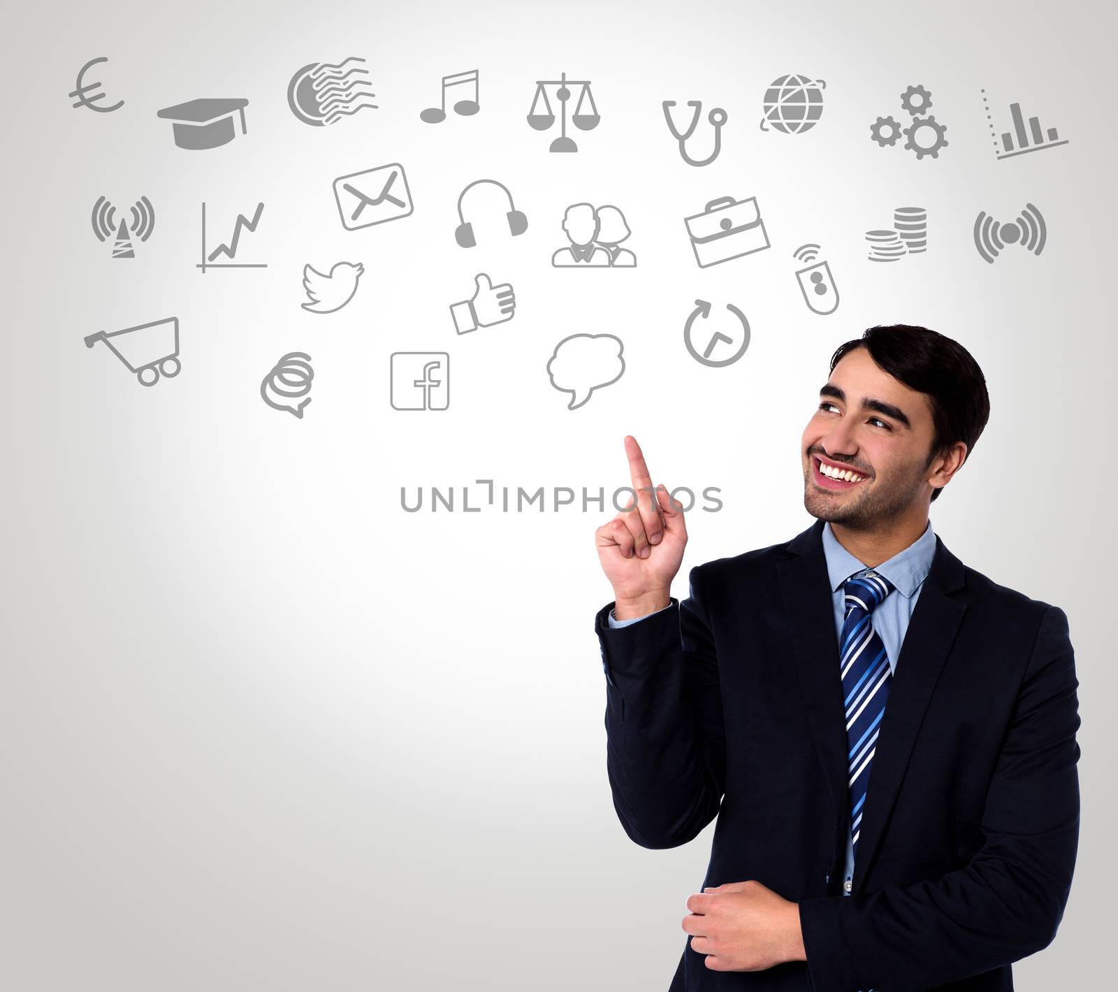 Man in suit choosing technology icons by stockyimages