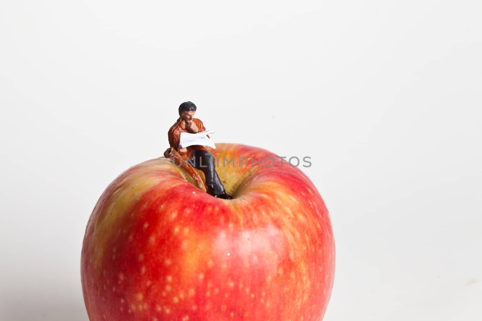 Miniature people in action in various situations