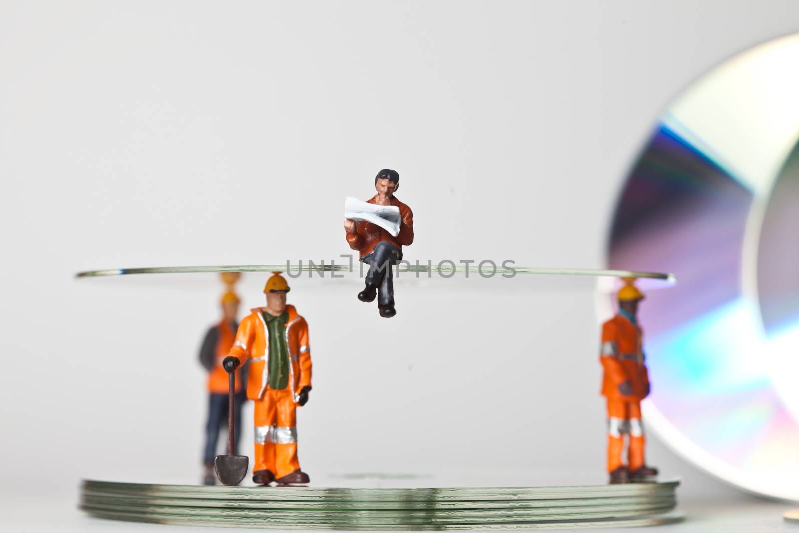 Miniature people in action in various situations