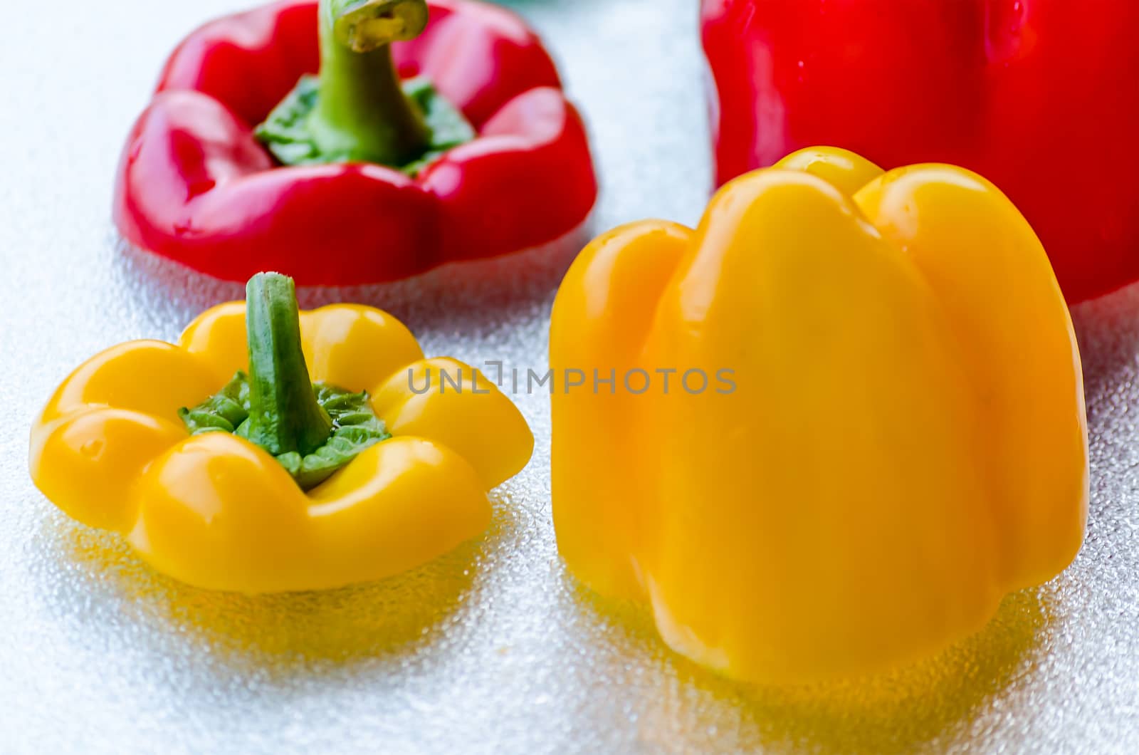Close-up  Red, Green, Yellow Bell Pepper washed on silver plate.