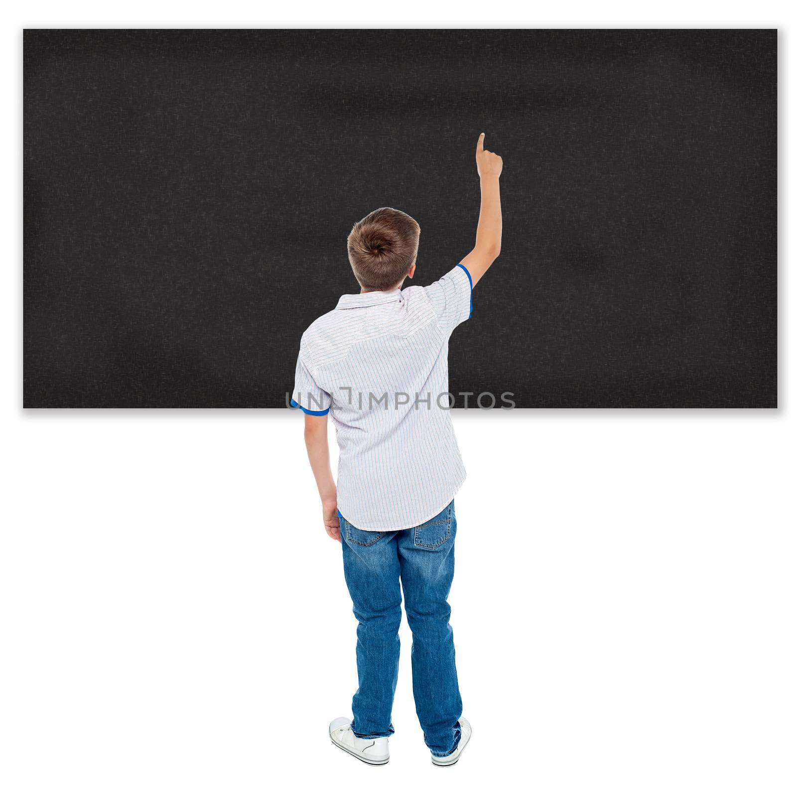 Rear view of a student pointing on a blackboard