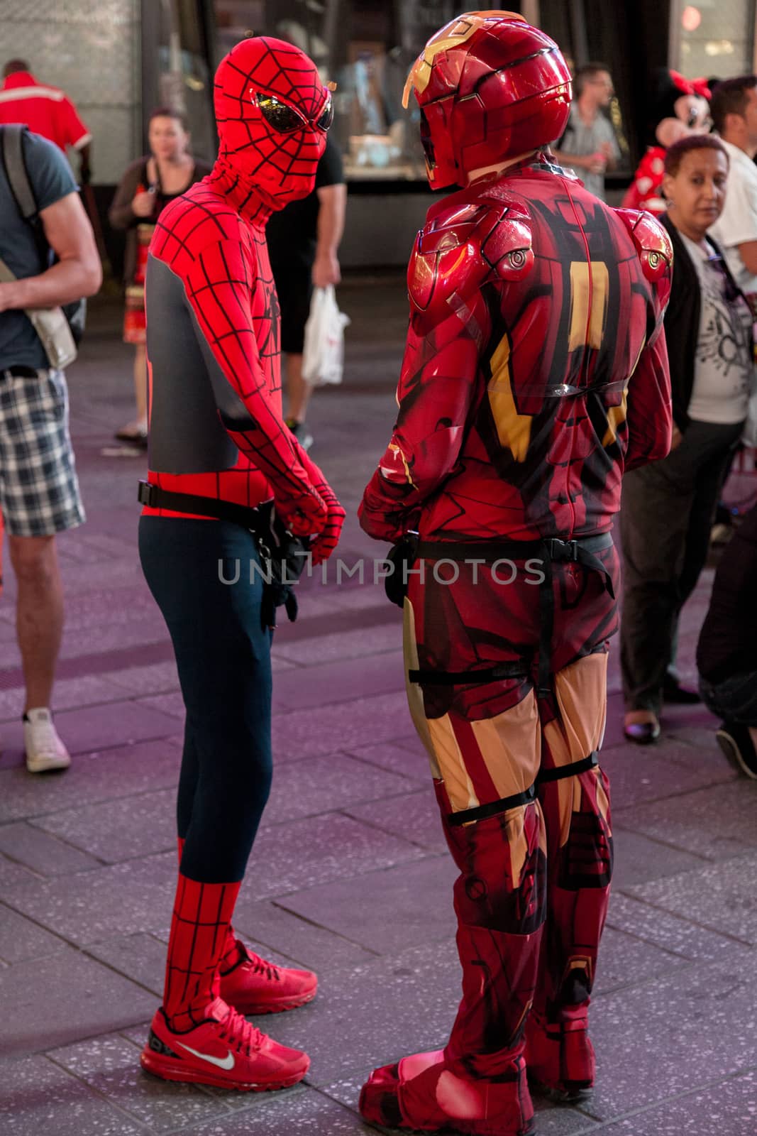 New York – Sept 2014: costumed superheroes and children's characters pose for photographs with Tourists on 42nd Street, Times Square on Sept 7, 2014 in New York, USA.