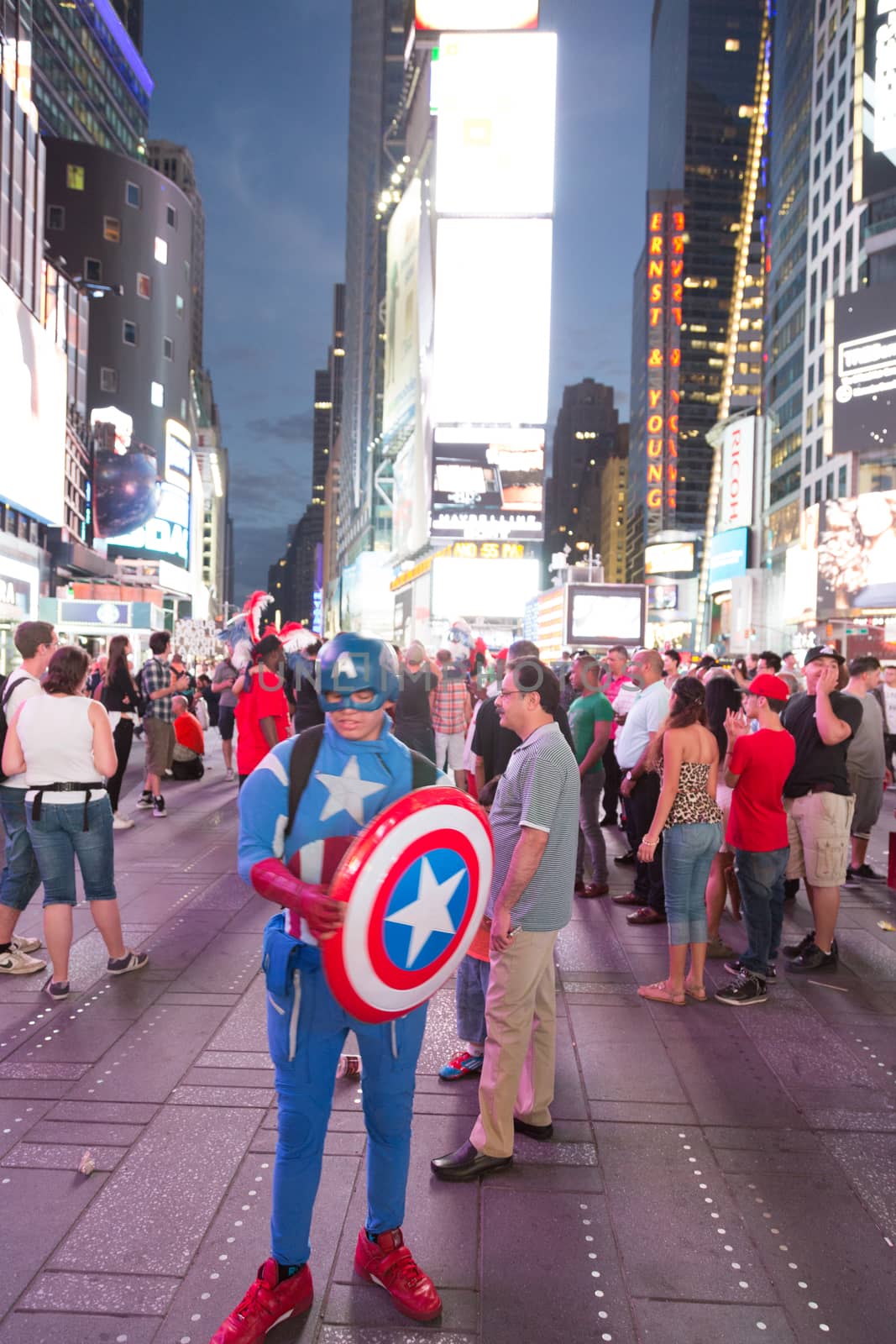 New York – Sept 2014: costumed superheroes and children's characters pose for photographs with Tourists on 42nd Street, Times Square on Sept 7, 2014 in New York, USA.