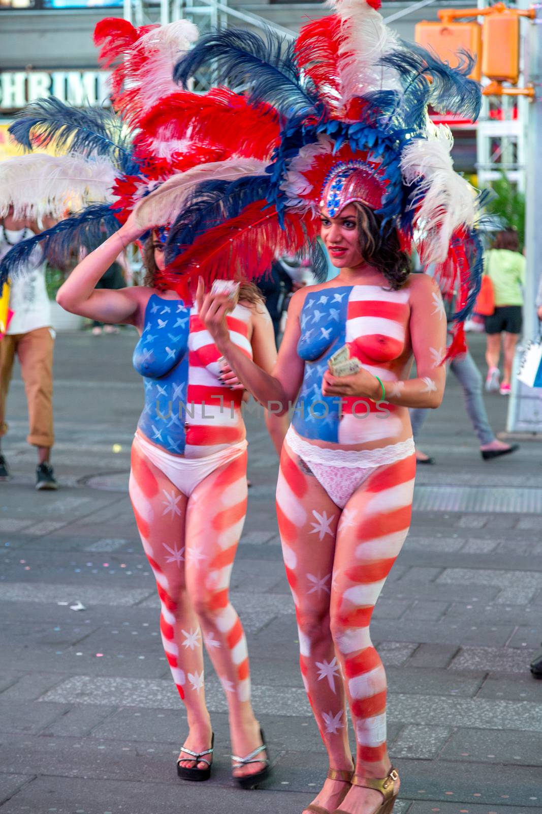 New York – Sept 2014: costumed superheroes and children's characters pose for photographs with Tourists on 42nd Street, Times Square on Sept 7, 2014 in New York, USA.