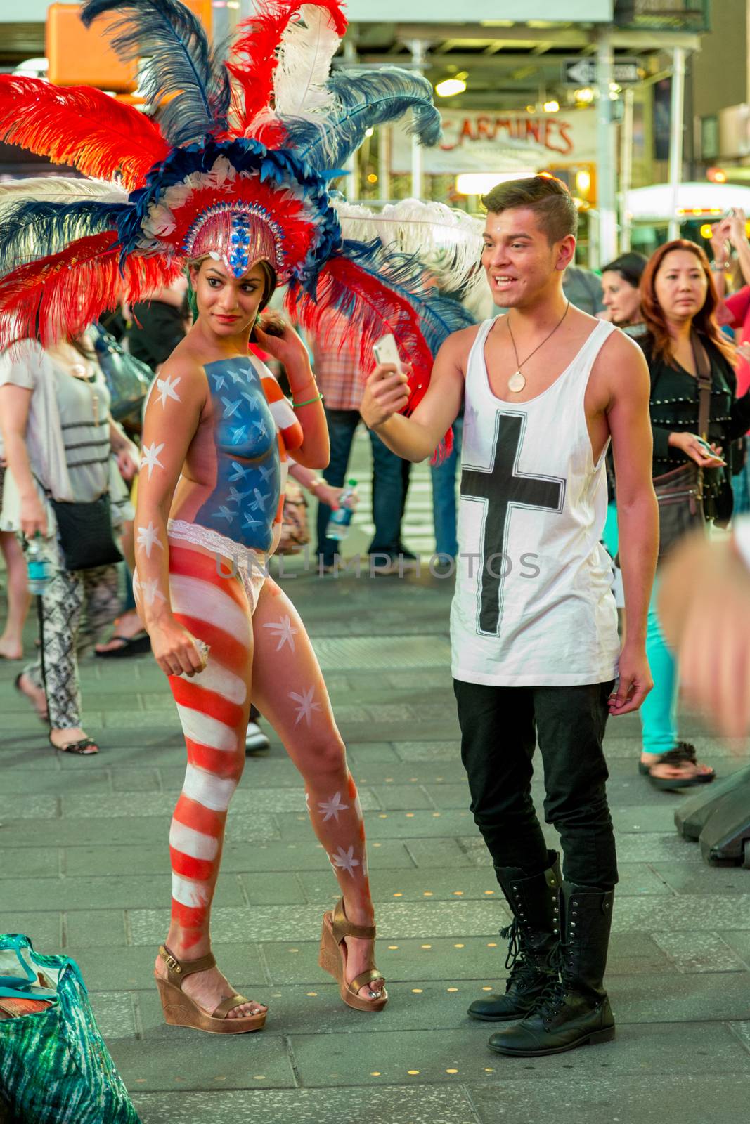 New York – Sept 2014: costumed superheroes and children's characters pose for photographs with Tourists on 42nd Street, Times Square on Sept 7, 2014 in New York, USA.