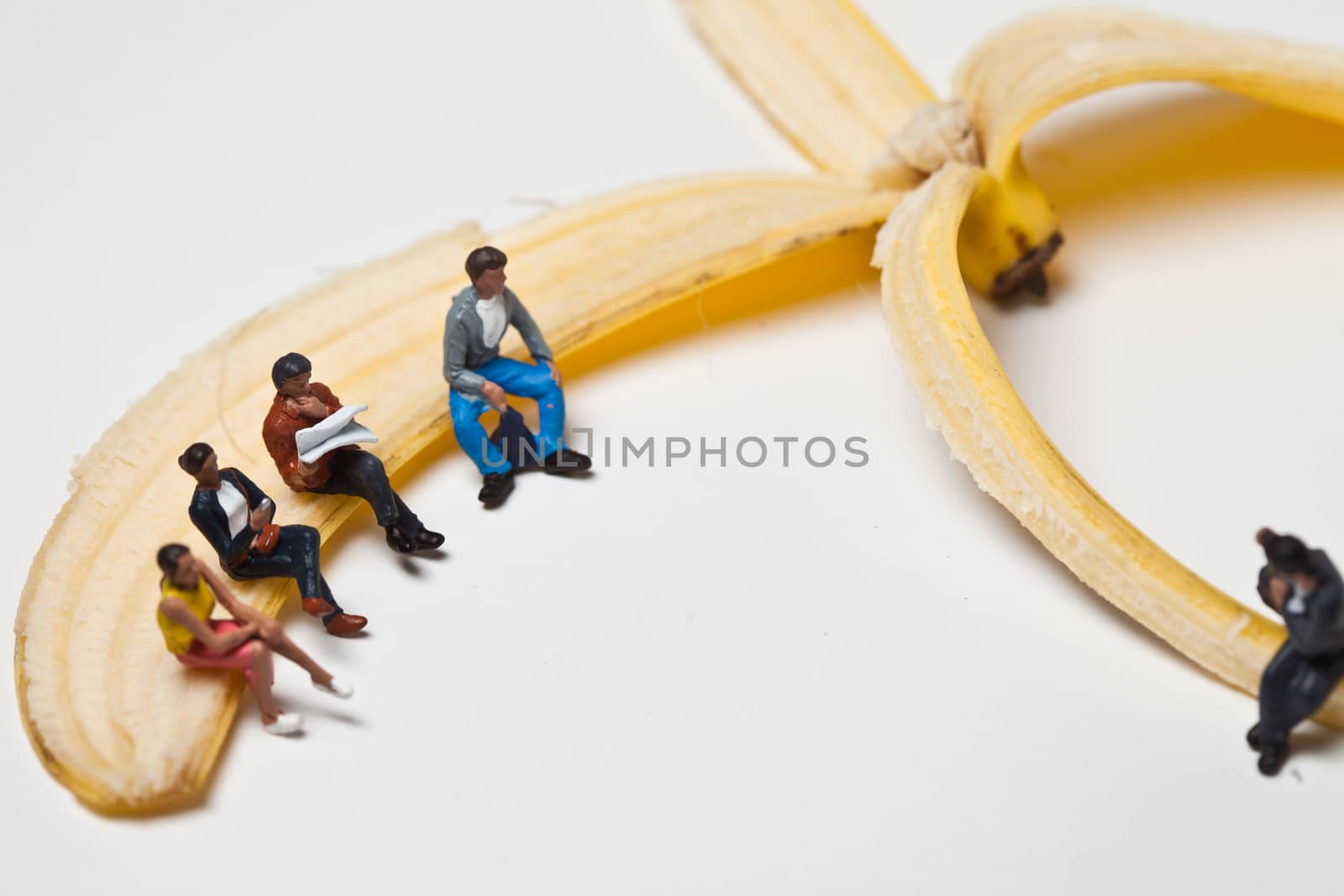 Miniature people in action in various situations