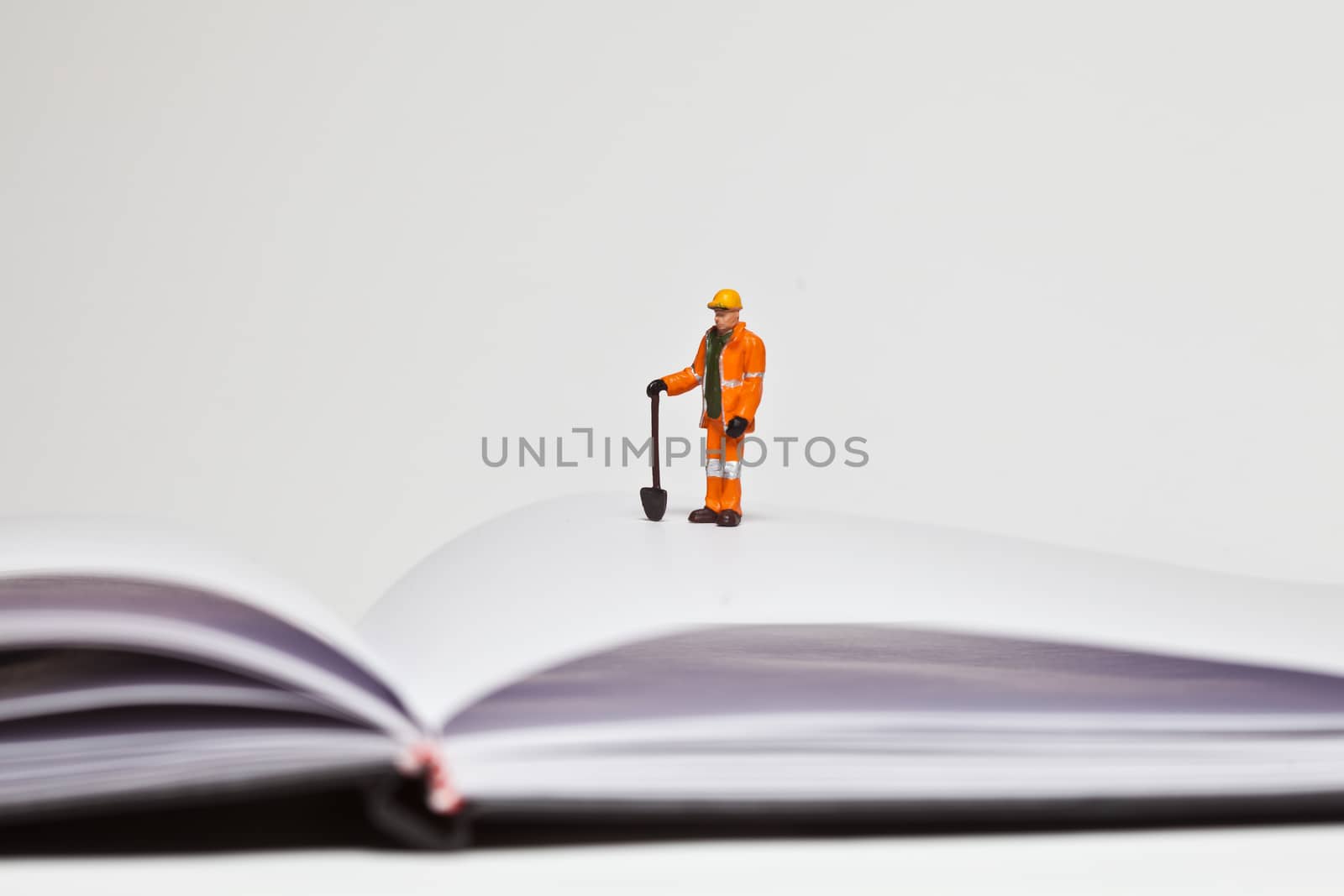 Miniature people in action in various situations