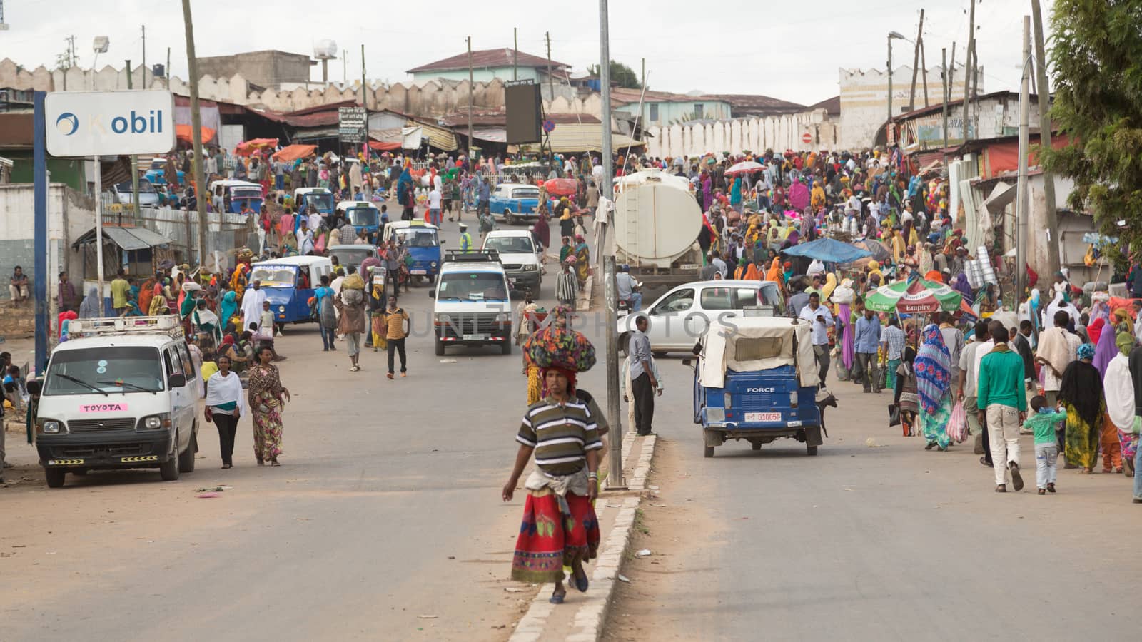 HARAR, ETHIOPIA - JULY 27,2014 - Local residents of Harar,considered as the fourth holy city of Islam, shopping in the street markets near the famous Shoa gate area.