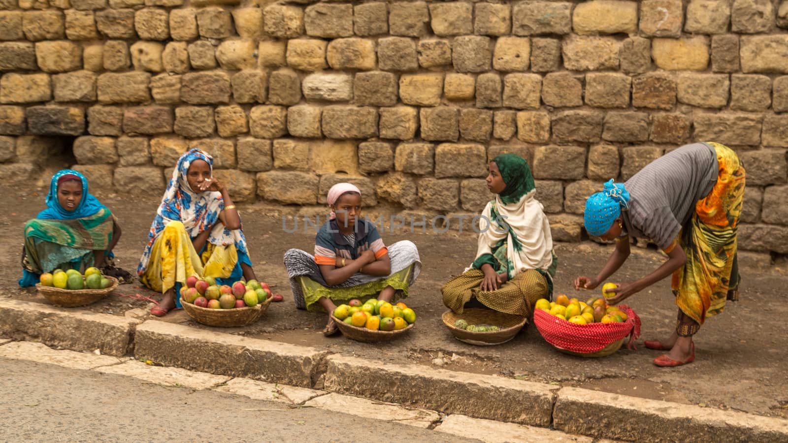 HARAR, ETHIOPIA - JULY 26,2014 - Local residents of Jugol, the fortified historic walled city within Harar, which was included in the World Heritage List for its cultural heritage by UNESCO and considered as the fourth holy city of Islam.