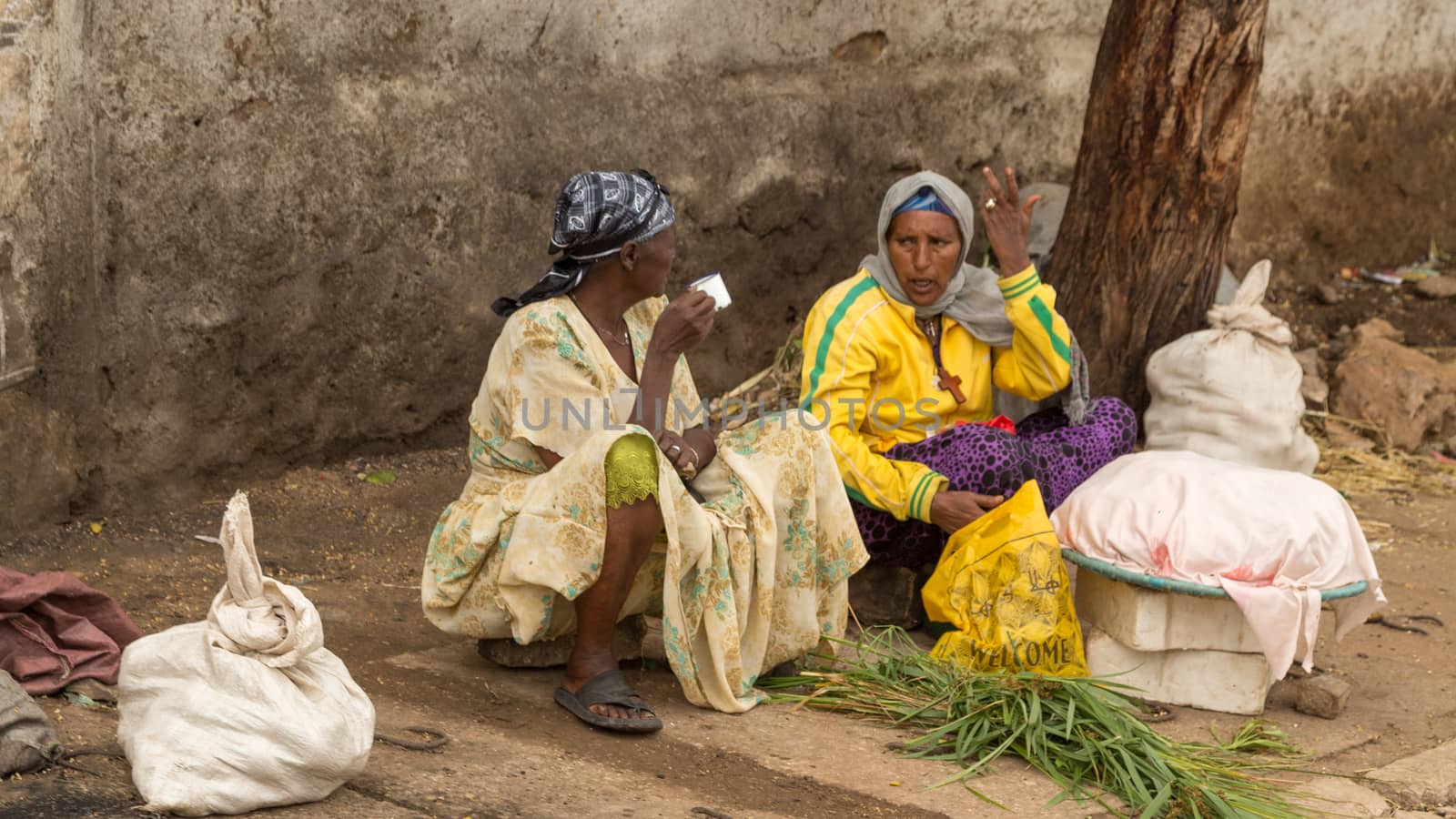 HARAR, ETHIOPIA - JULY 26,2014 - Local residents of Jugol, the fortified historic walled city within Harar, which was included in the World Heritage List for its cultural heritage by UNESCO and considered as the fourth holy city of Islam.