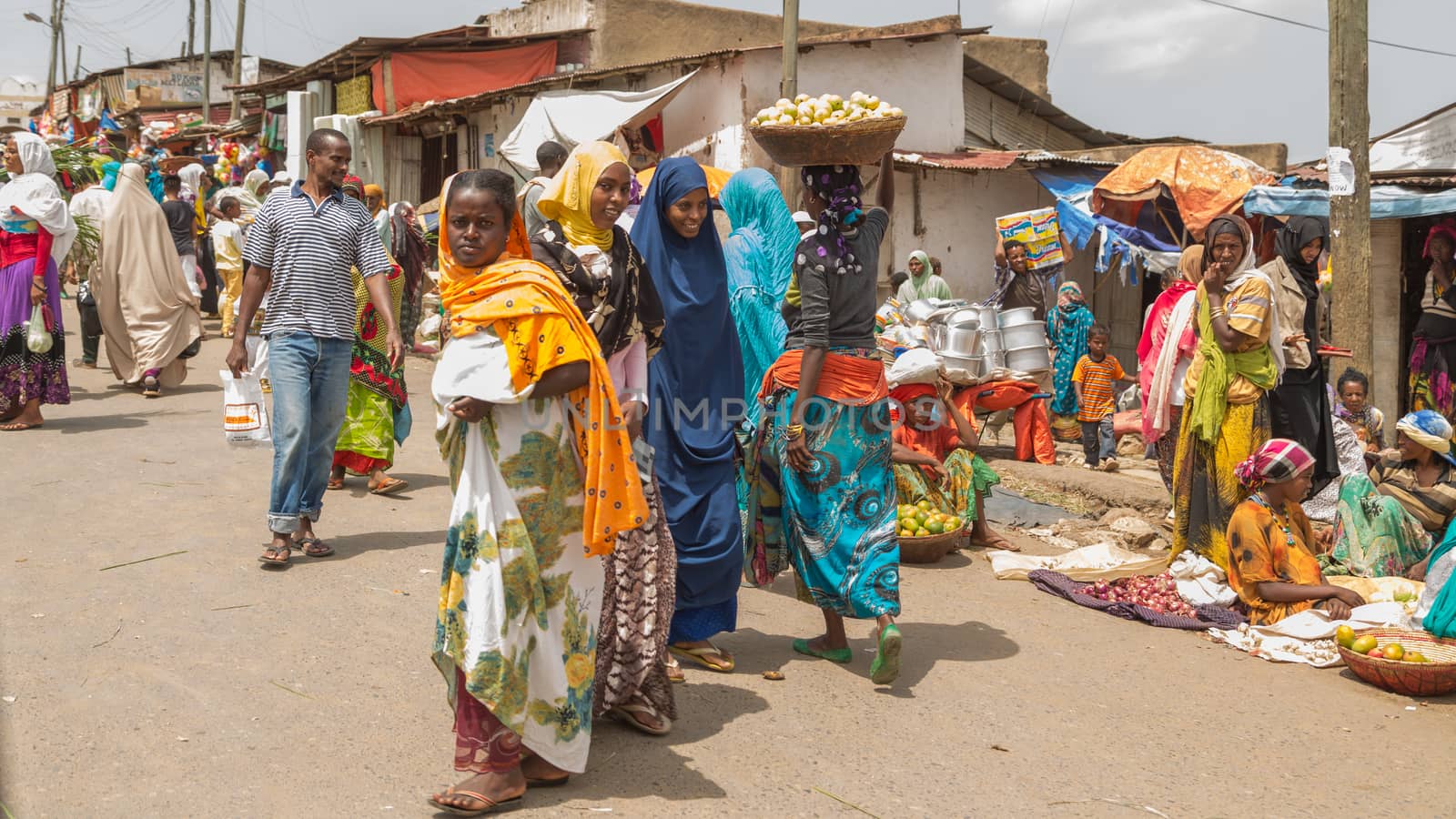 HARAR, ETHIOPIA - JULY 26,2014 - Local residents of Jugol, the fortified historic walled city within Harar, which was included in the World Heritage List for its cultural heritage by UNESCO and considered as the fourth holy city of Islam.