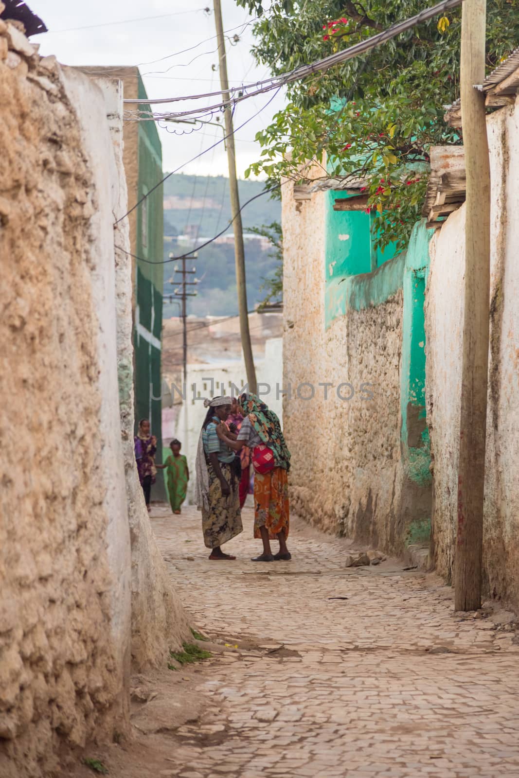 HARAR, ETHIOPIA - JULY 26,2014 - Local residents of Jugol, the fortified historic walled city within Harar, which was included in the World Heritage List for its cultural heritage by UNESCO and considered as the fourth holy city of Islam.