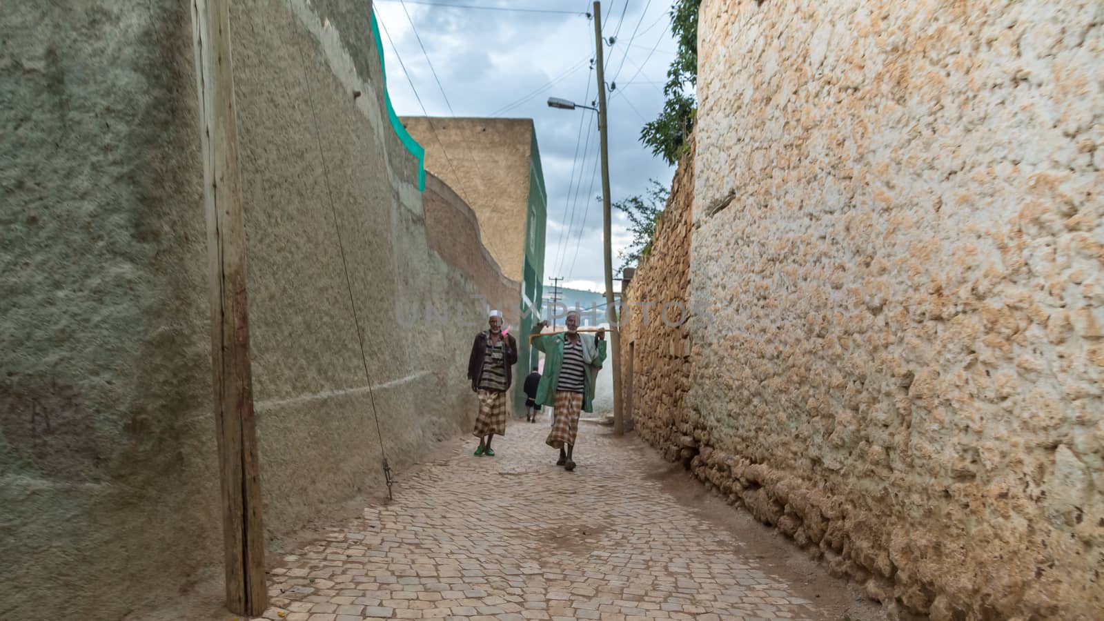 HARAR, ETHIOPIA - JULY 26,2014 - Local residents of Jugol, the fortified historic walled city within Harar, which was included in the World Heritage List for its cultural heritage by UNESCO and considered as the fourth holy city of Islam.