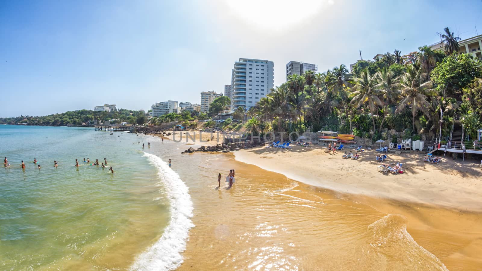 Dakar, Senegal - July 2014: Tourists and the local residents of Dakar spend their holidays on the beautiful beaches on July 11, 2014 in Dakar, Senegal