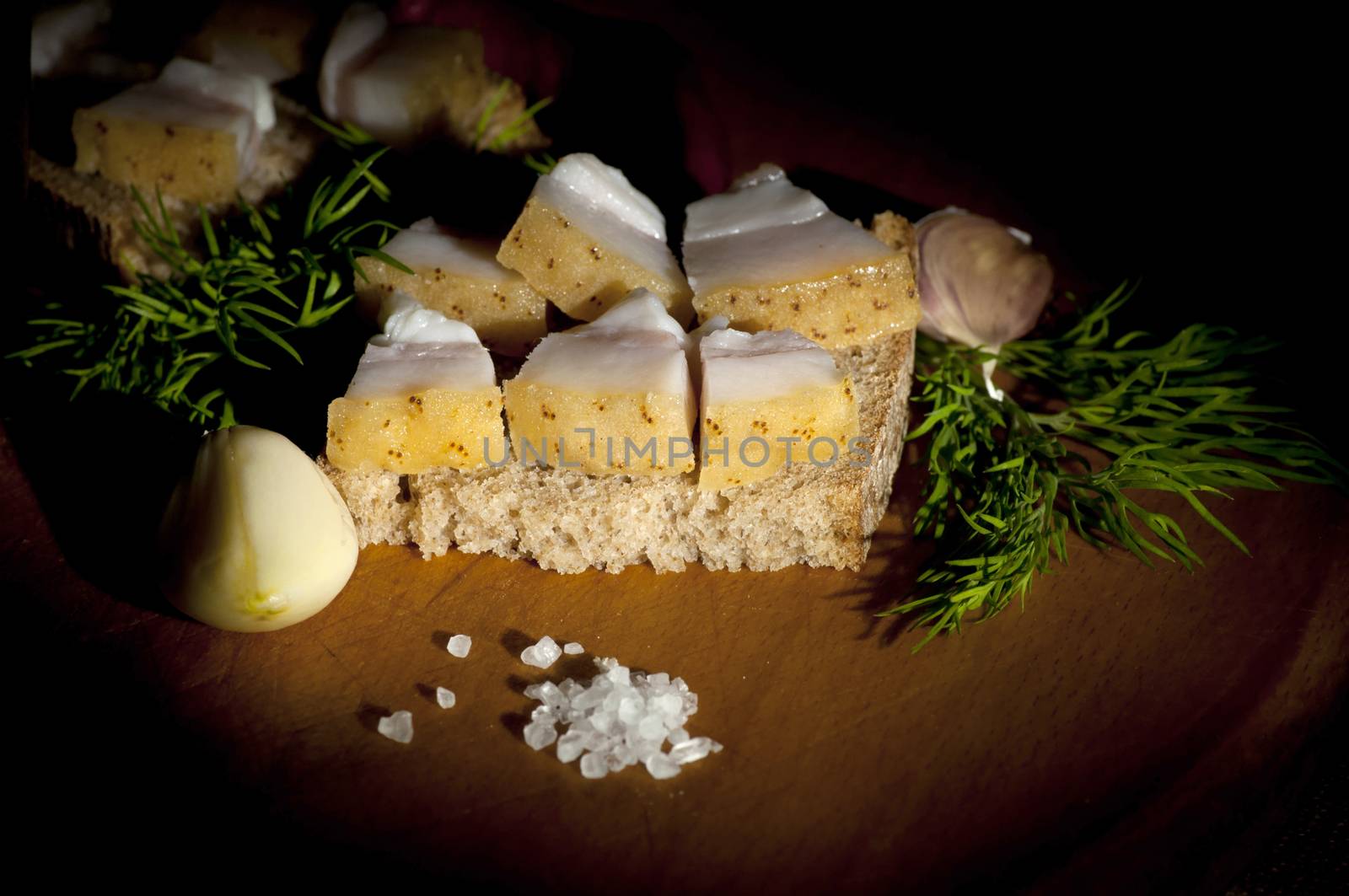 Sandwich with salted served with garlic and dill