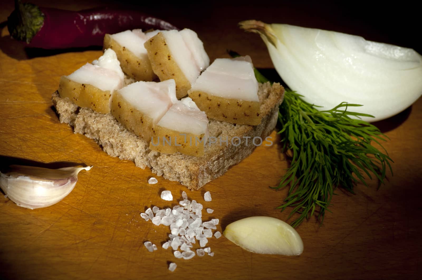 Sandwich with salted served with garlic, onion and dill