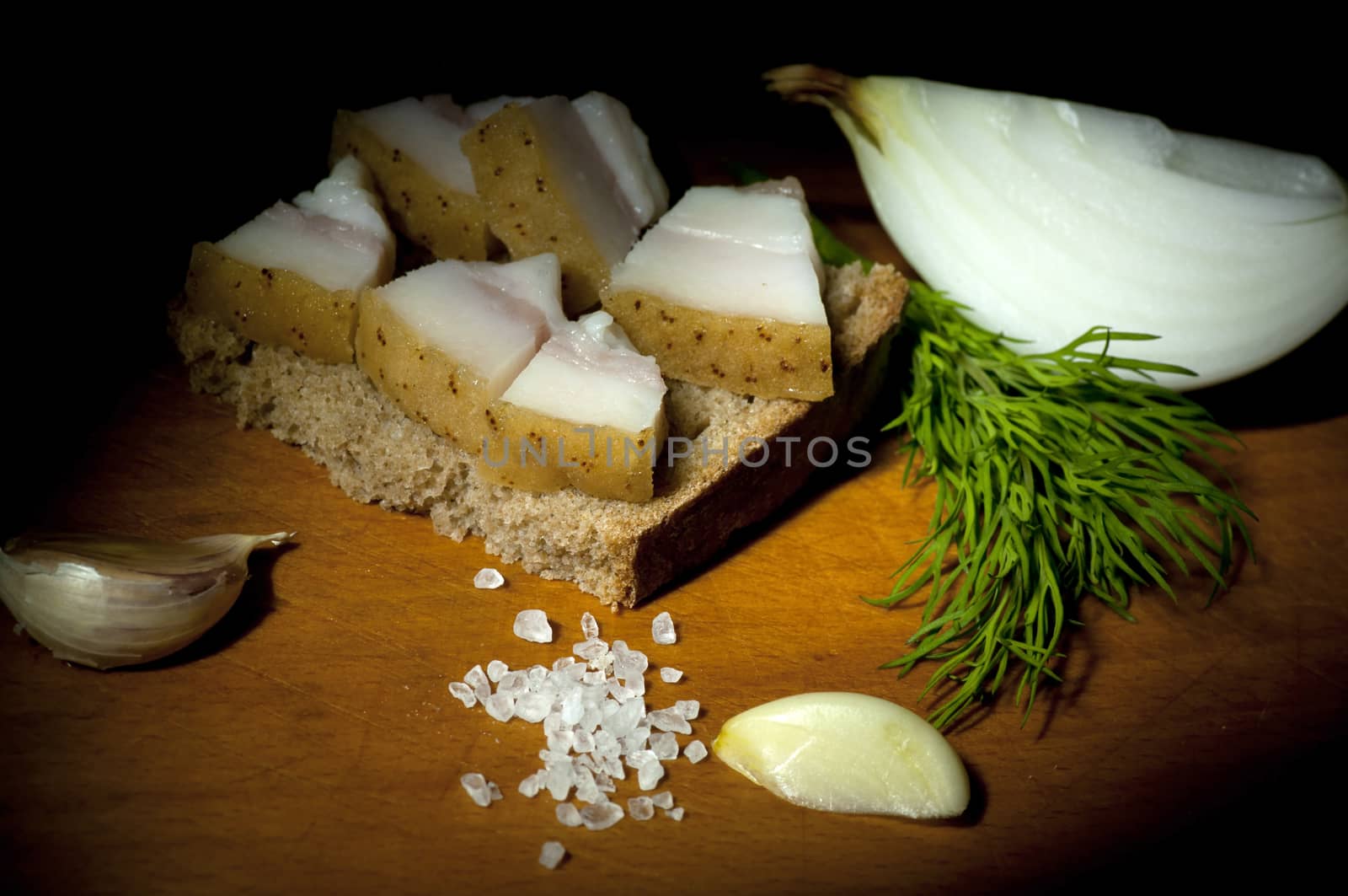 Sandwich with salted served with garlic, onion and dill