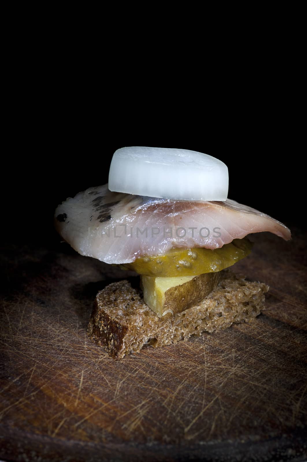 Canape with herring, potato, cucumber and onion by dred