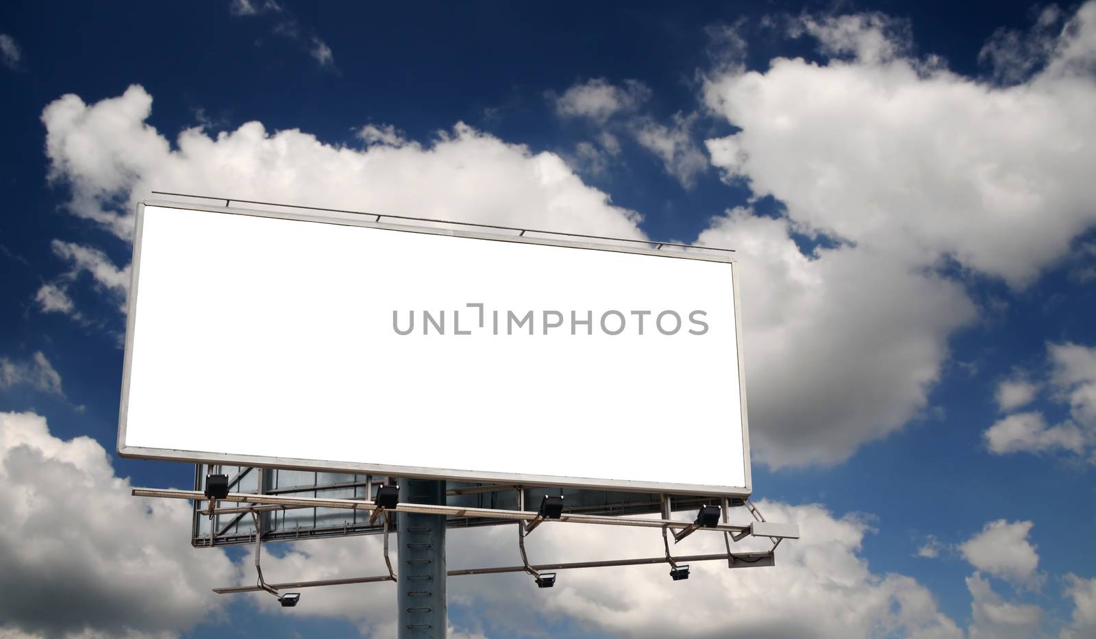 Blank Billboard Screen in front of beautiful cloudy sky