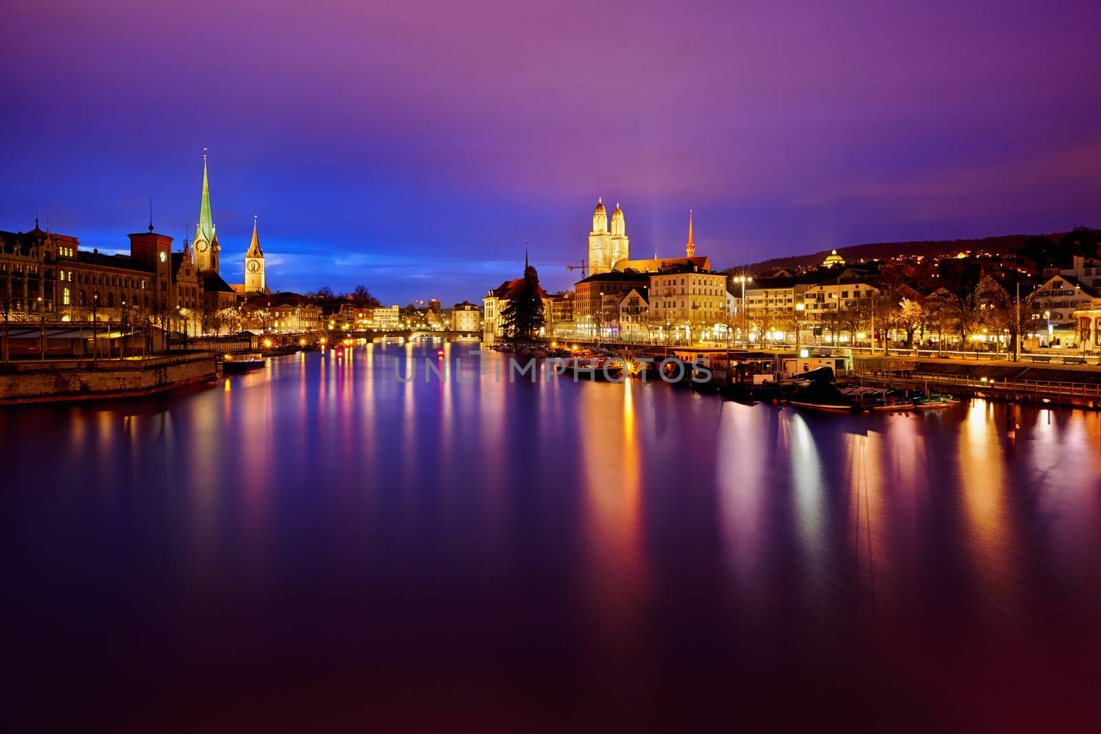 view on Fraumunster Church, Church of St. Peter and Grossmunster at night, Zurich, Switzerland