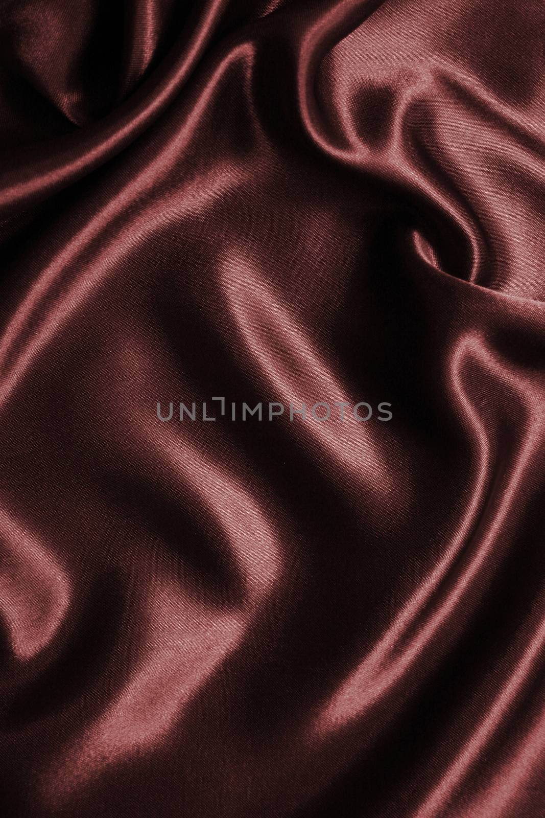 Smooth elegant dark brown chocolate silk as background  by oxanatravel
