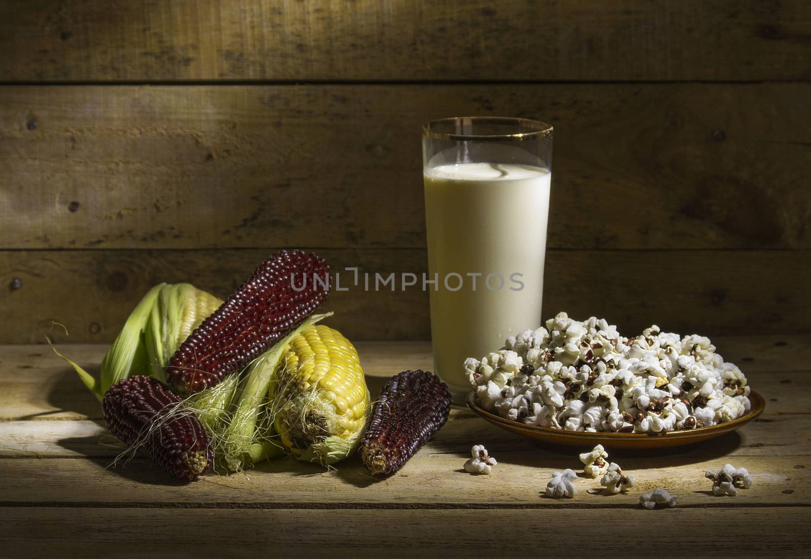 autumn still life with corn, popcorn and milk