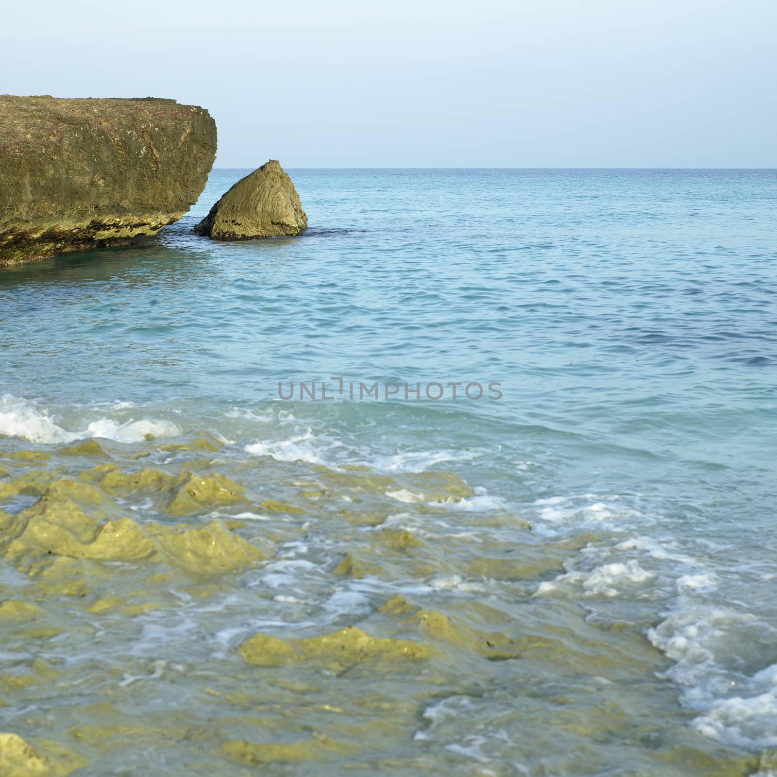 Porous sharp rocky ocean cliff