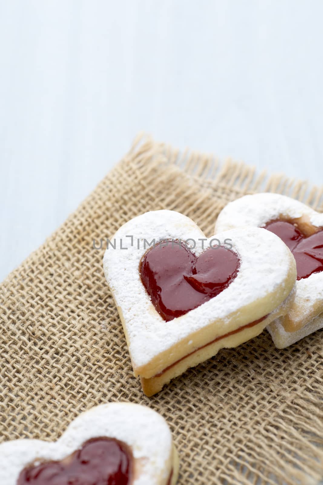 Cookies heart shape on the wooden ackground.