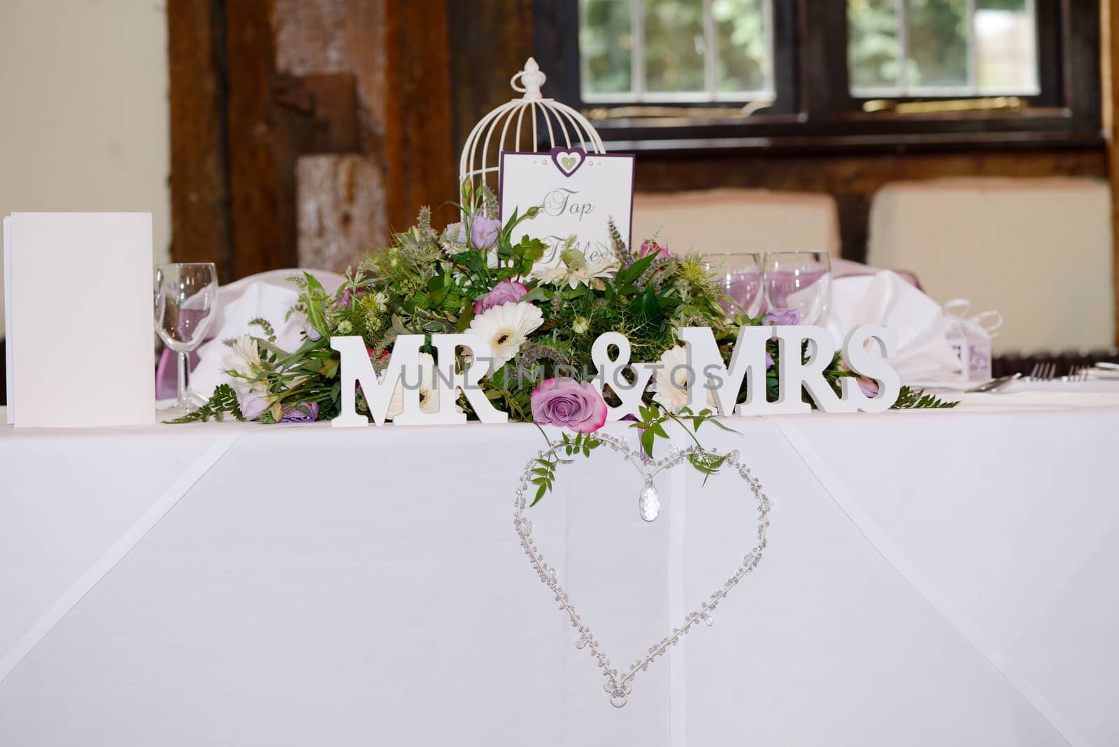 Mr & Mrs decoration at wedding reception with detail of heart and jewels