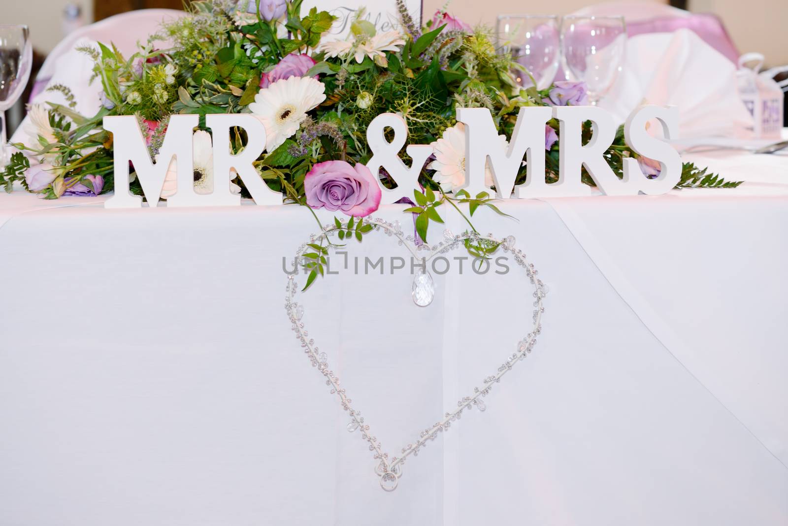 Decoration at wedding reception is heart shape with mr & mrs