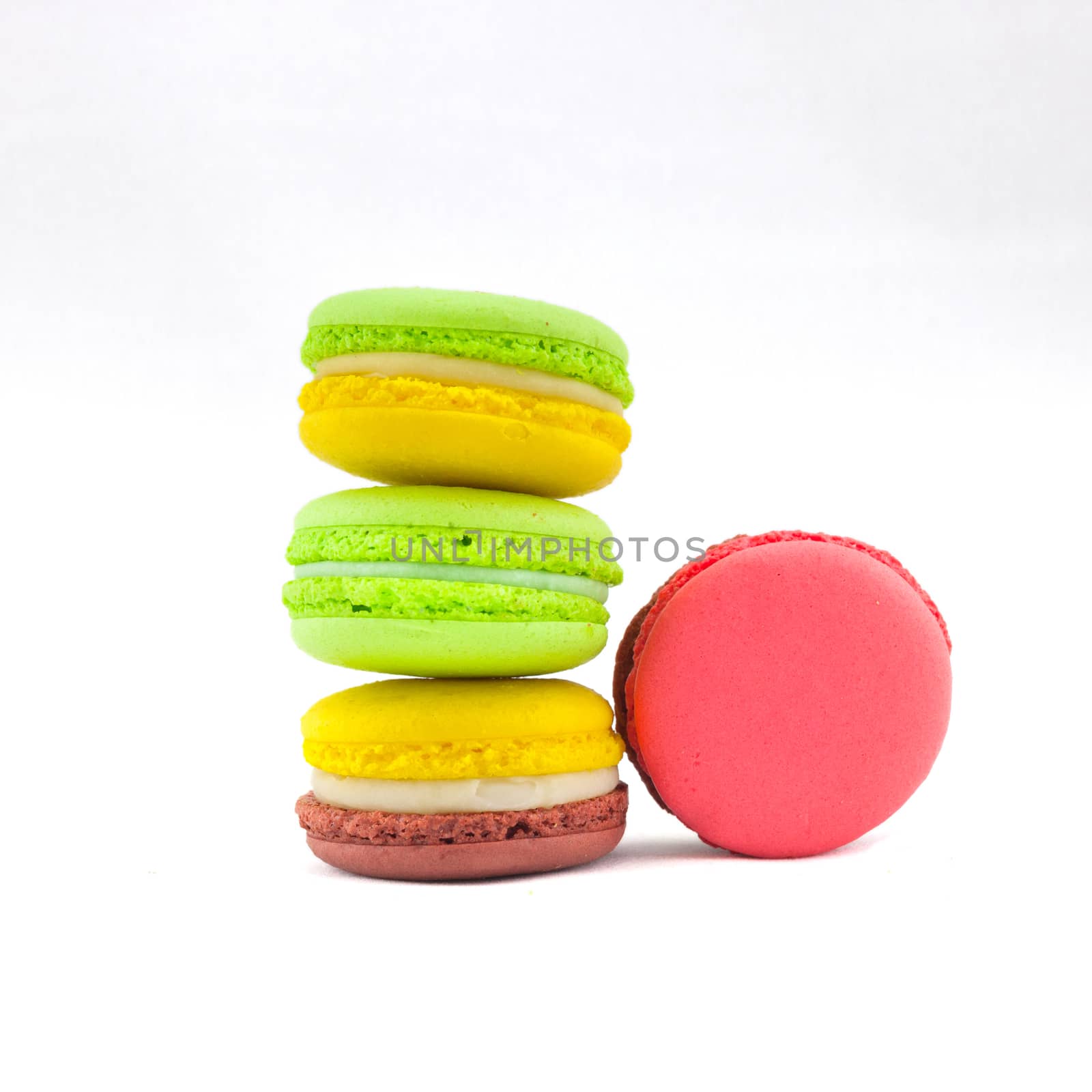 Sweet and colourful french macaroons isolated on white backgrou by nopparats