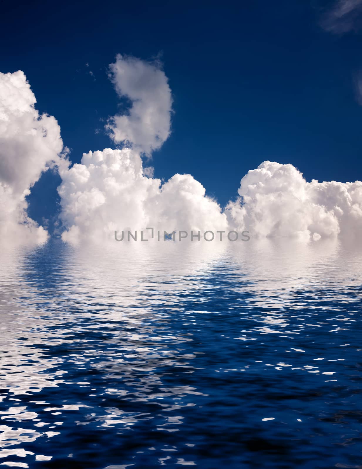 
Landscape: white clouds in the blue sky reflected in water