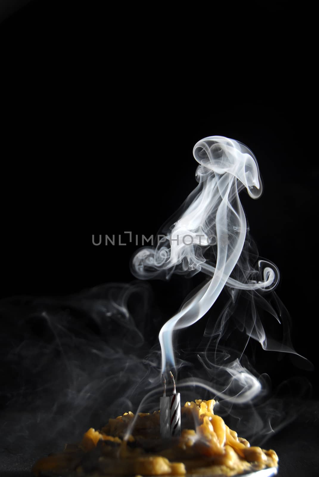 White candle smoke at dark background by simply