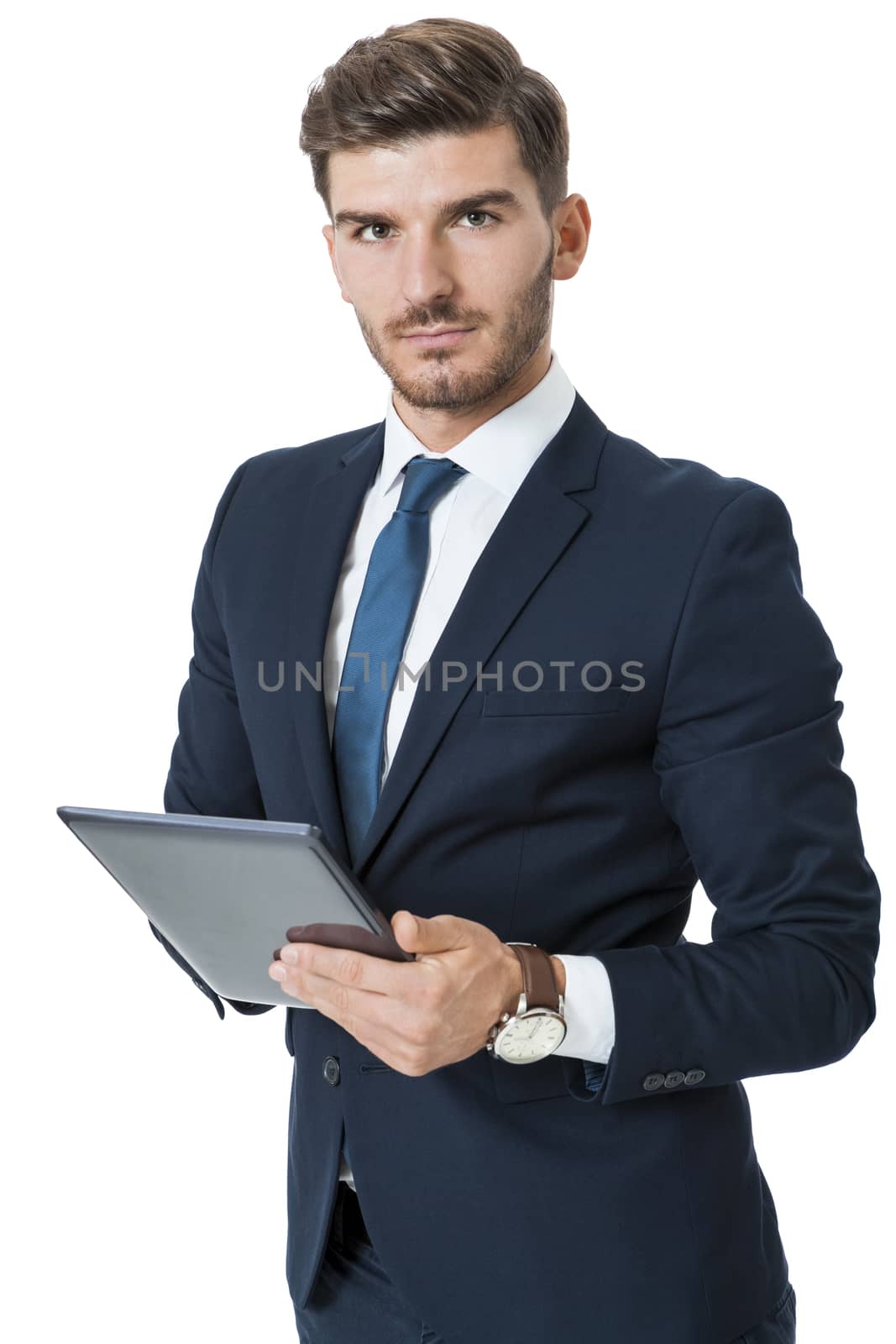 Businessman using a tablet computer navigating the touchscreen with his finger as he surfs the internet, close up view of his hands and the tablet, on white