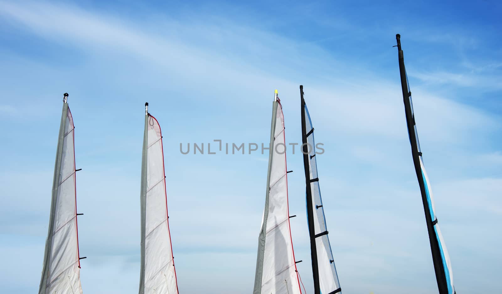 set of different sails for watersport on the beach