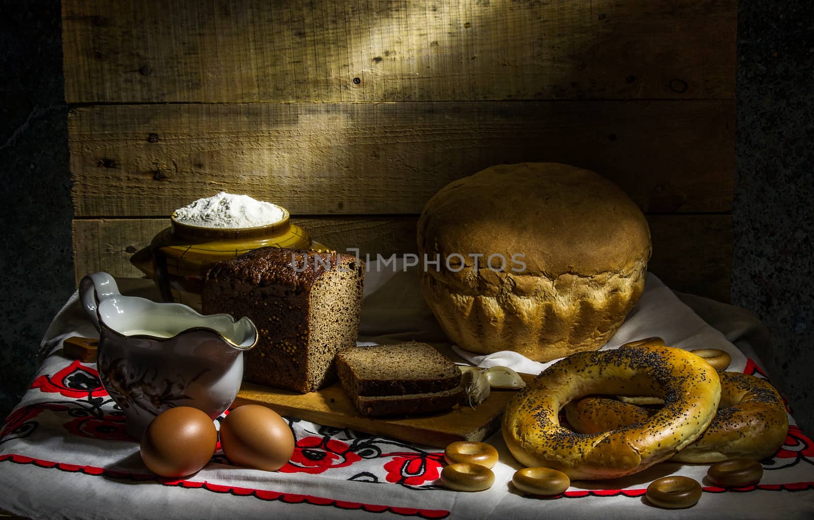still life with black, white bread, bagels and drying