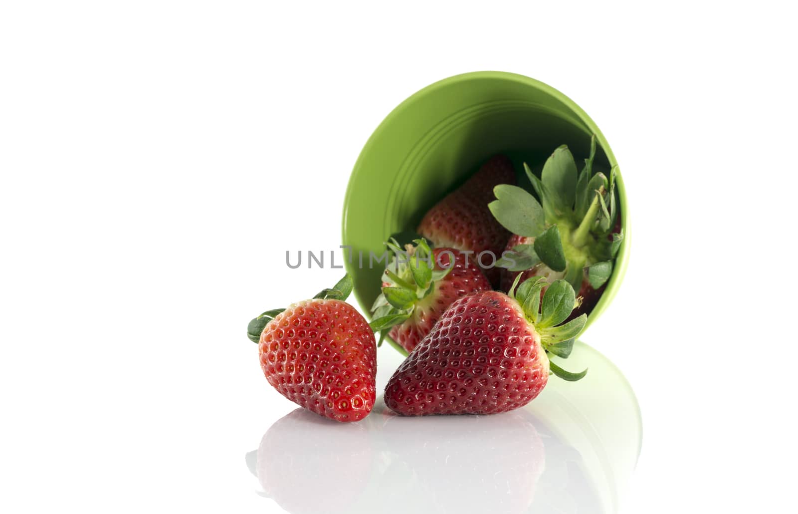 green bucket with red fruit by compuinfoto