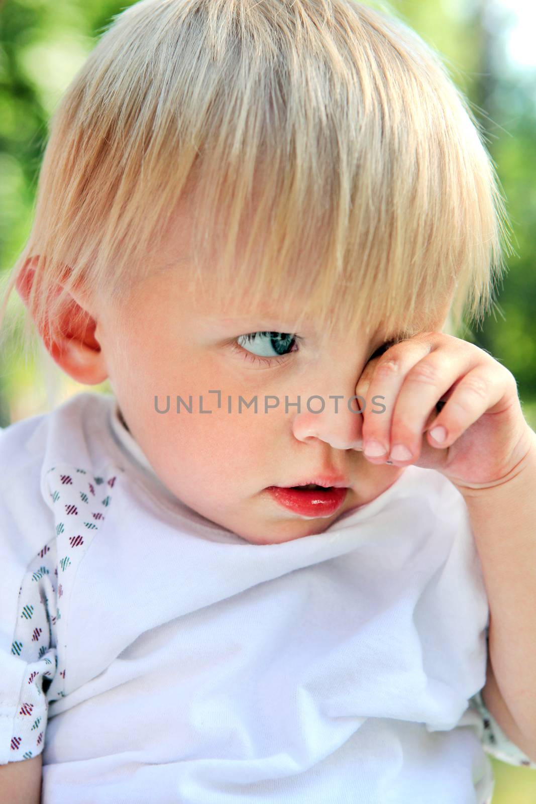 Sad Child Portrait at the Summer Park