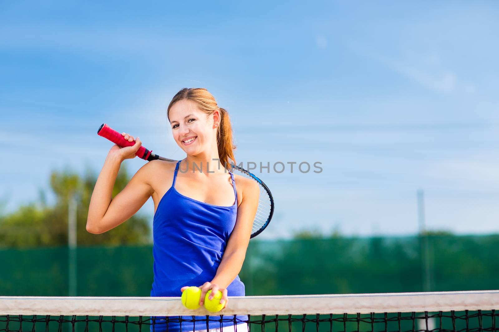 Portrait of a pretty young tennis player with copyspace by viktor_cap