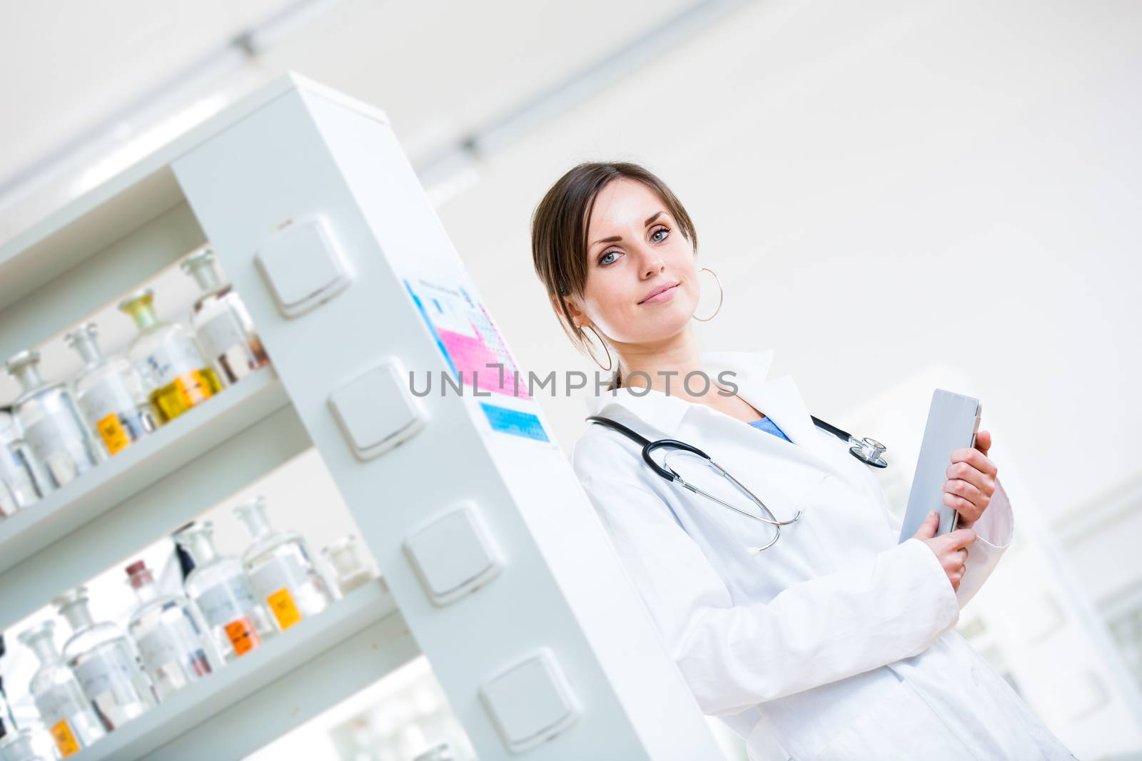 Pretty, female doctor in a hospital lab by viktor_cap