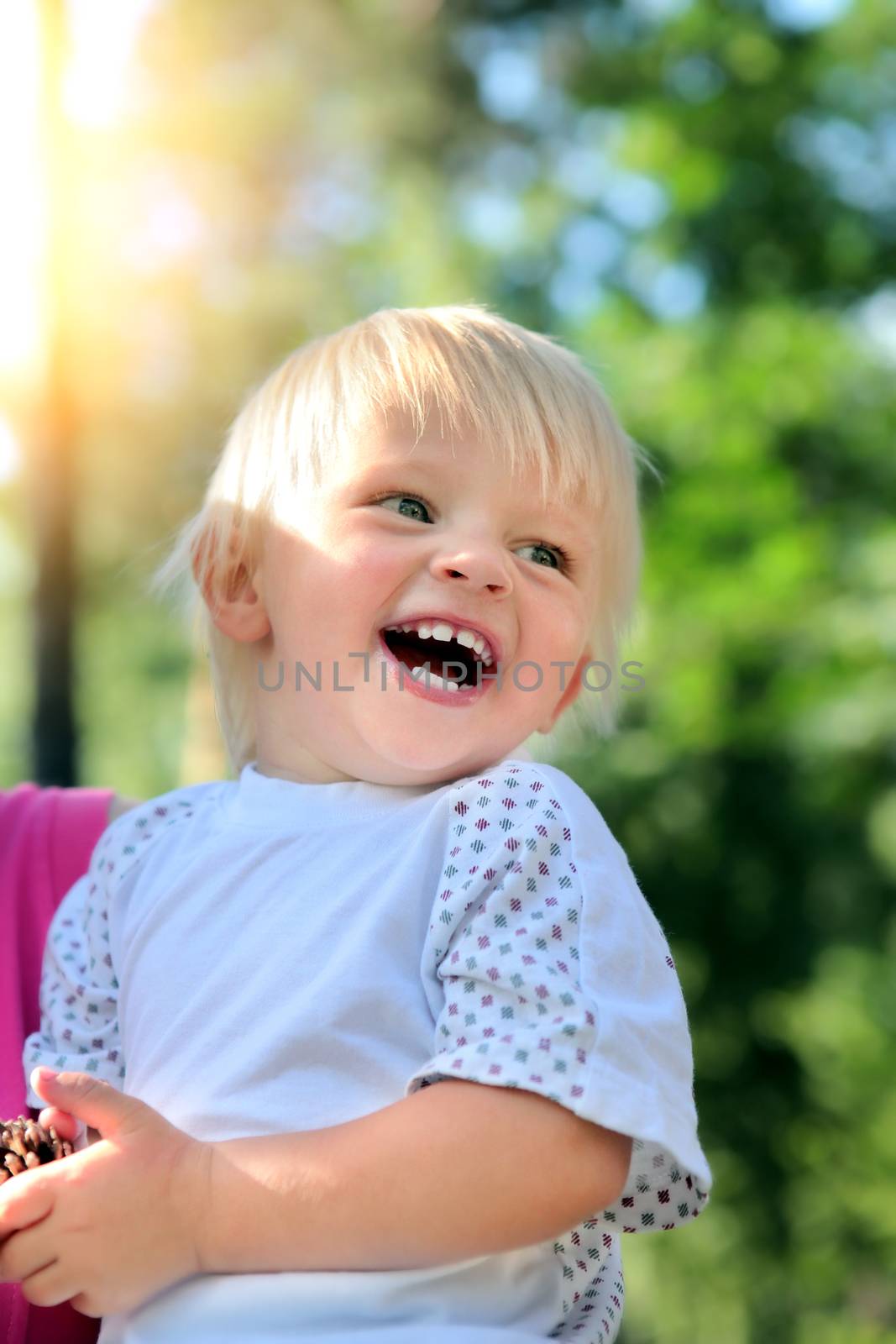 Happy Child laugh in the Summer Park