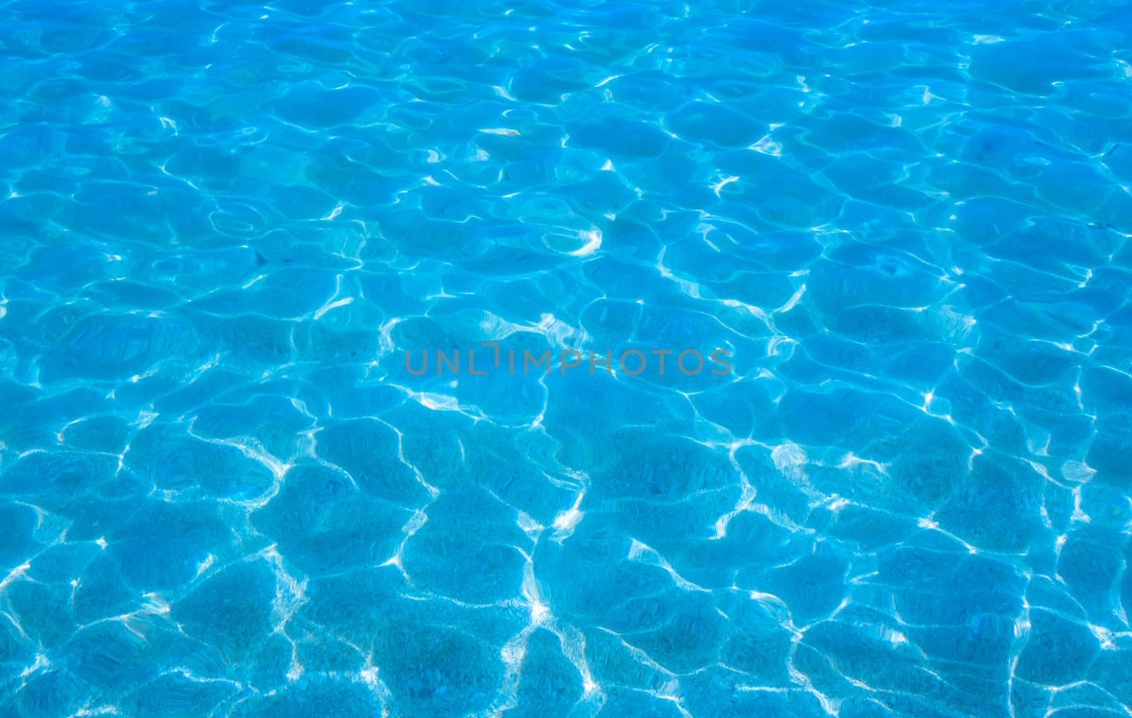 Waters edge. Closeup of sandy beach with crystal clear water, Mallorca, Balearic islands, Spain.