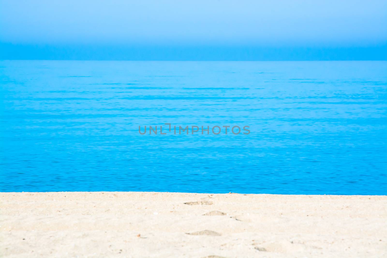 Sand tracks and footprints into the water. Mallorca, Balearic islands, Spain.