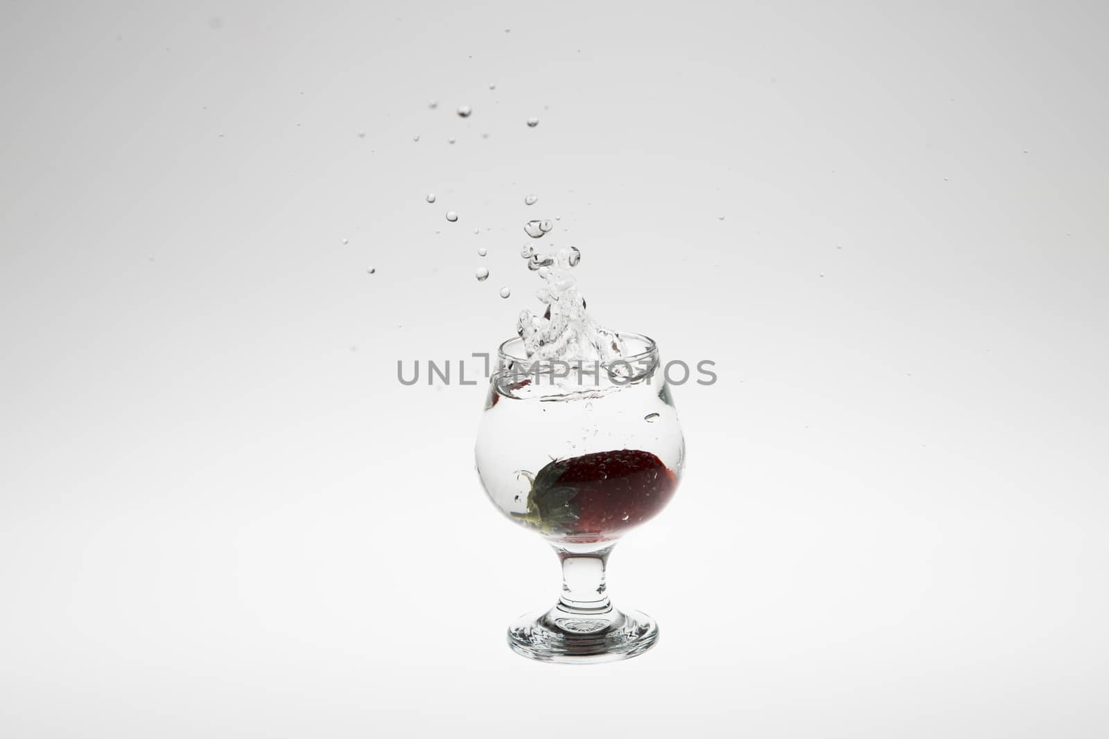 strawberry in the water splash on white background